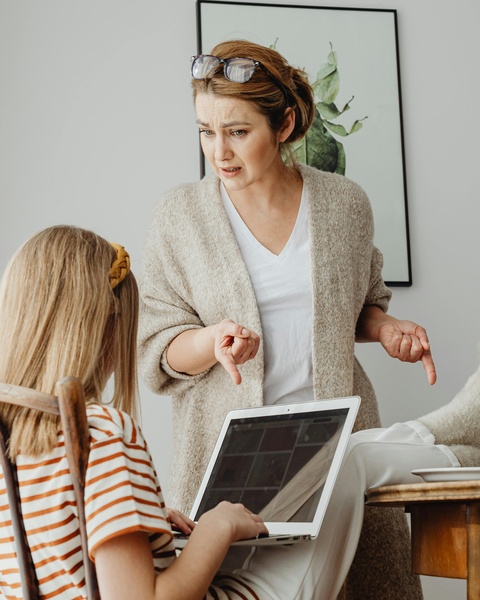 Angry Mother Scolding Daughter Doing Homework