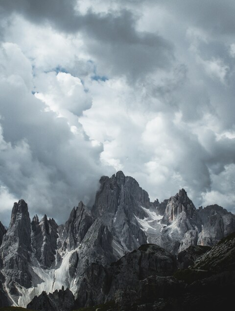 Jagged Peaks Under Cloudy Sky