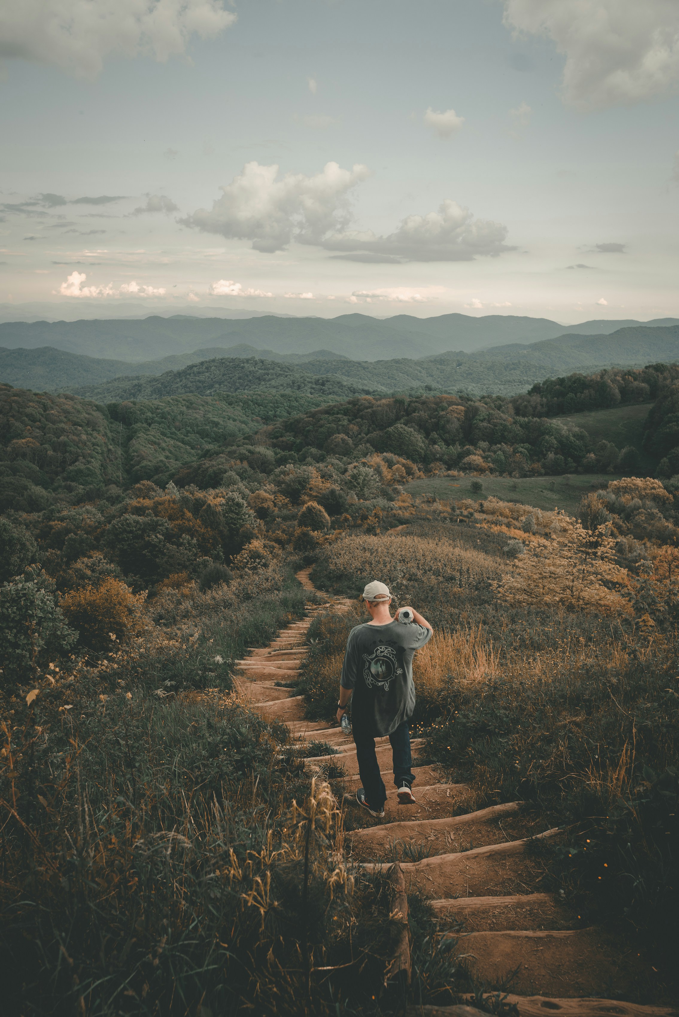 Hiker Walking on Mountain Trail
