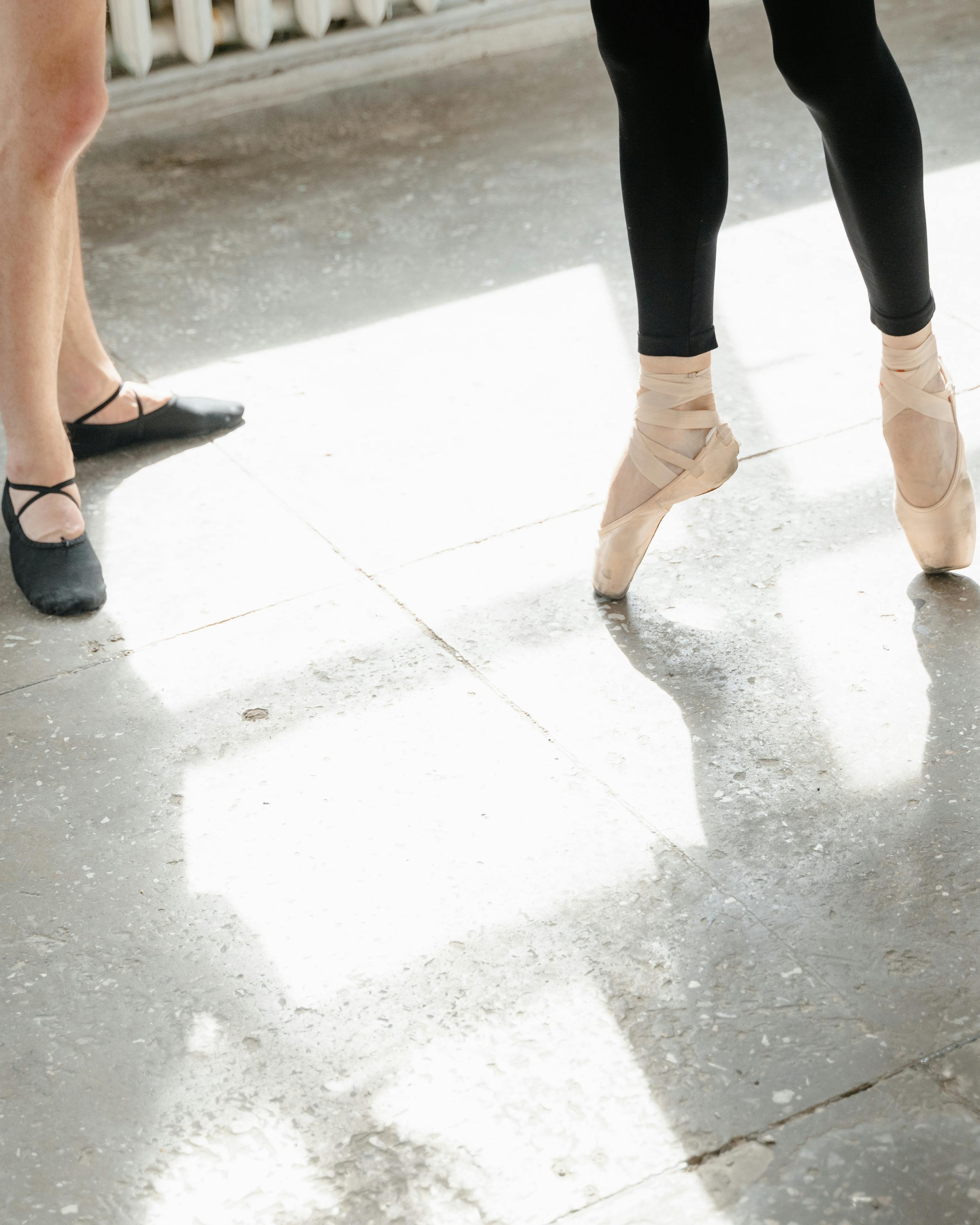 Ballet Dancers' Feet in Dance Studio