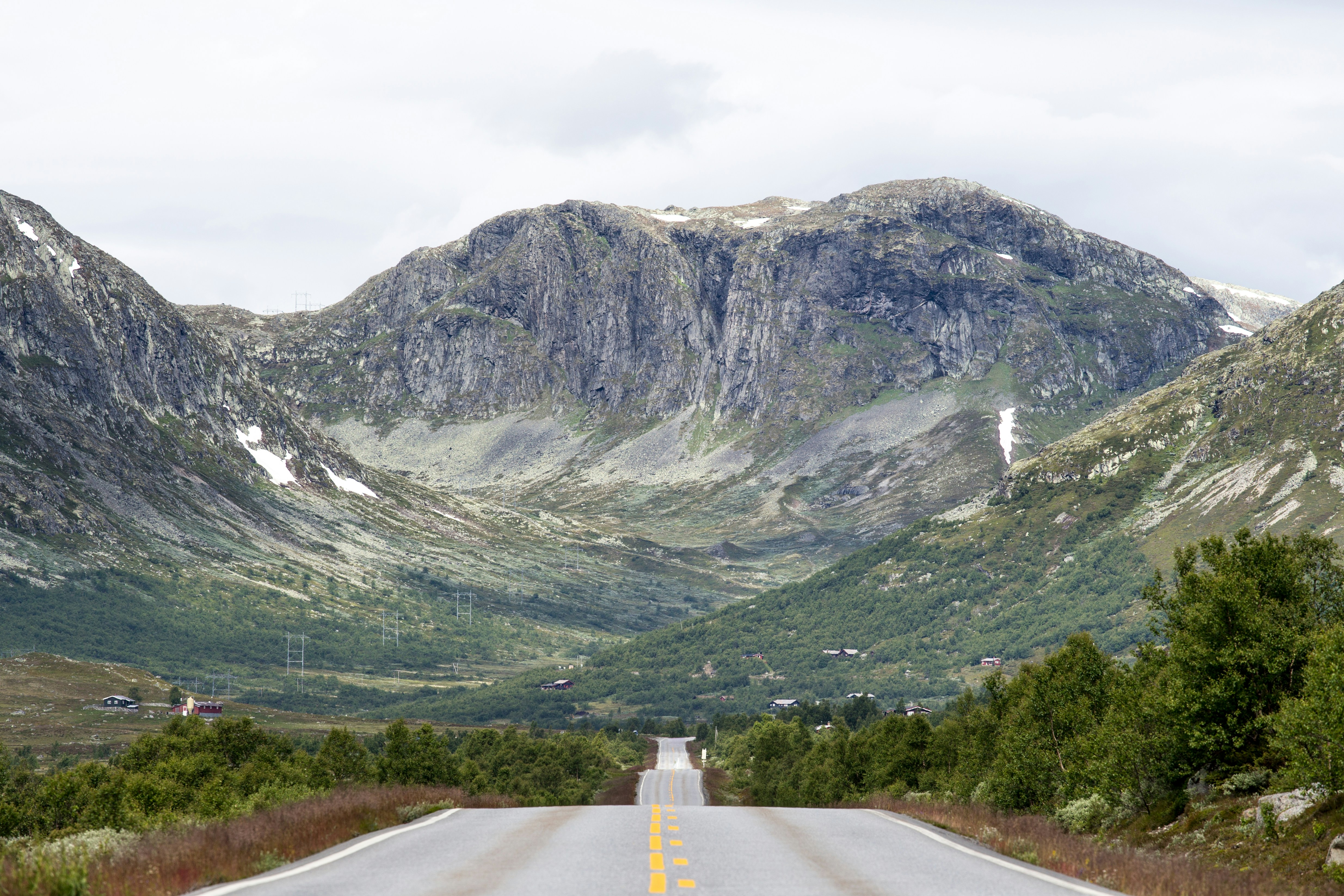 Mountain Road Toward Rocky Peaks