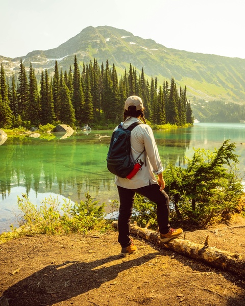 Hiker Overlooking Mountain Alpine Lake