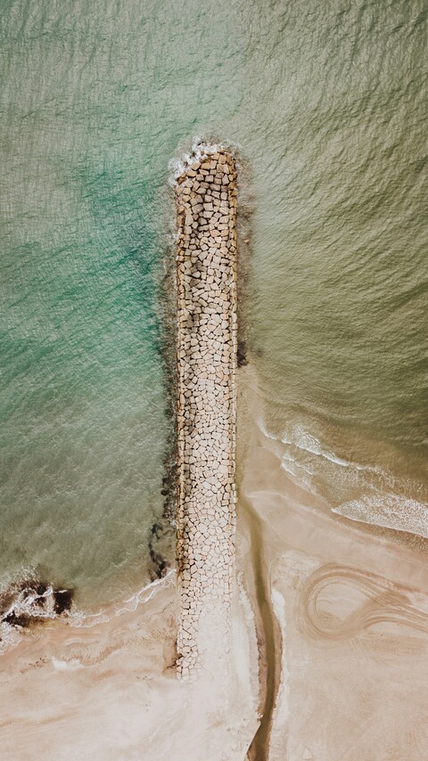 Aerial View of Coastal Stone Breakwater