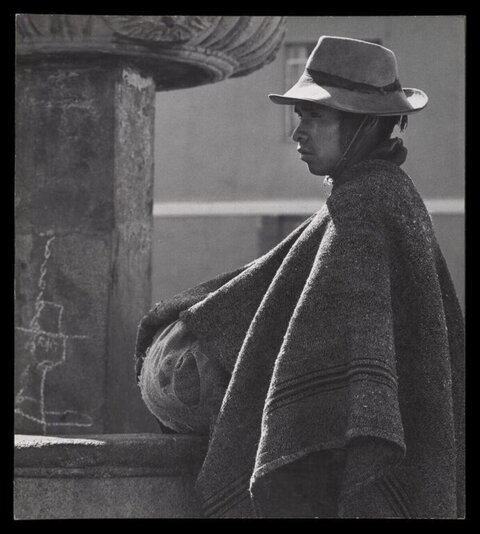 Indigenous Man By Stone Fountain