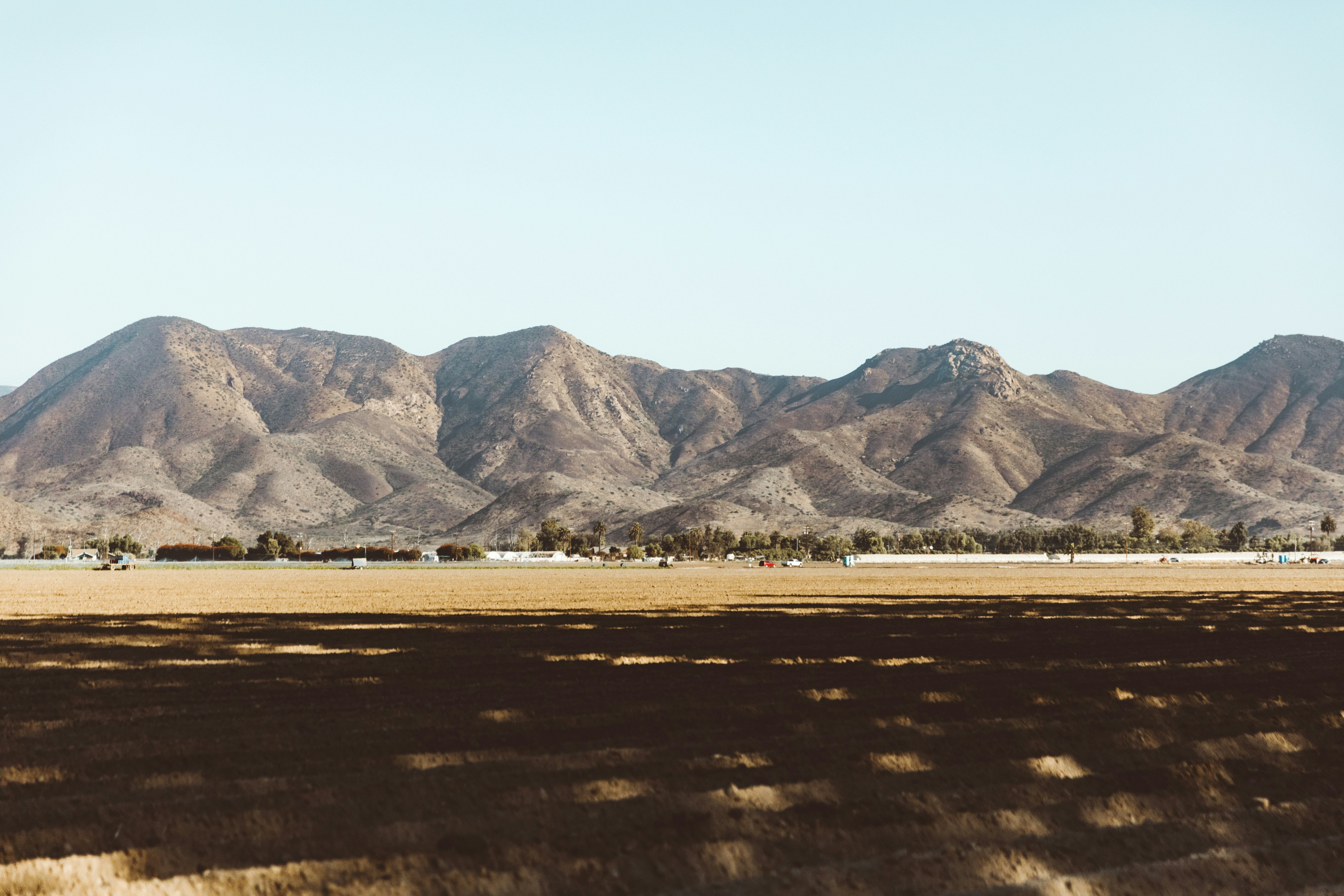 Plowed Field Before Arid Mountains