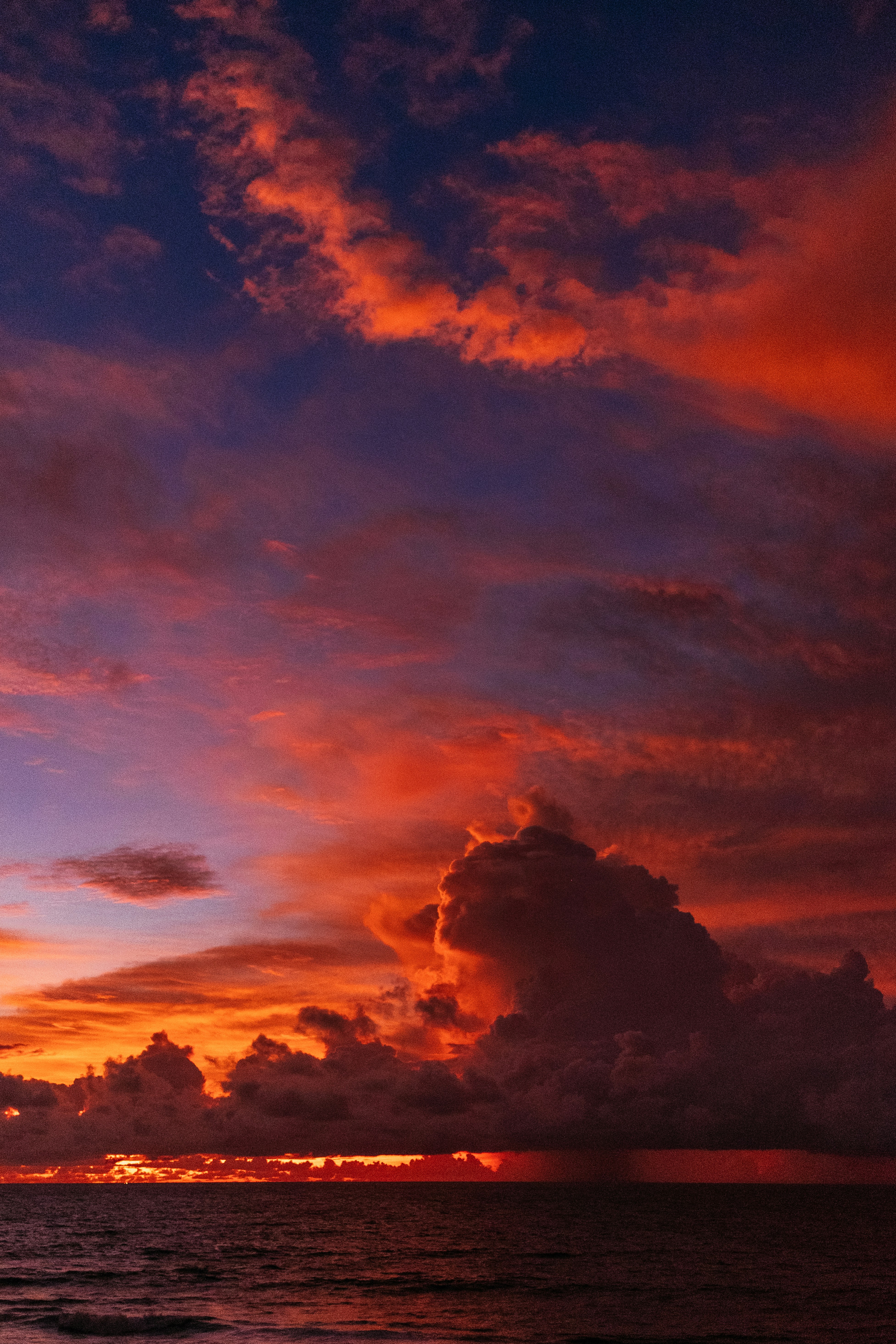 Ocean Sunset With Red Clouds
