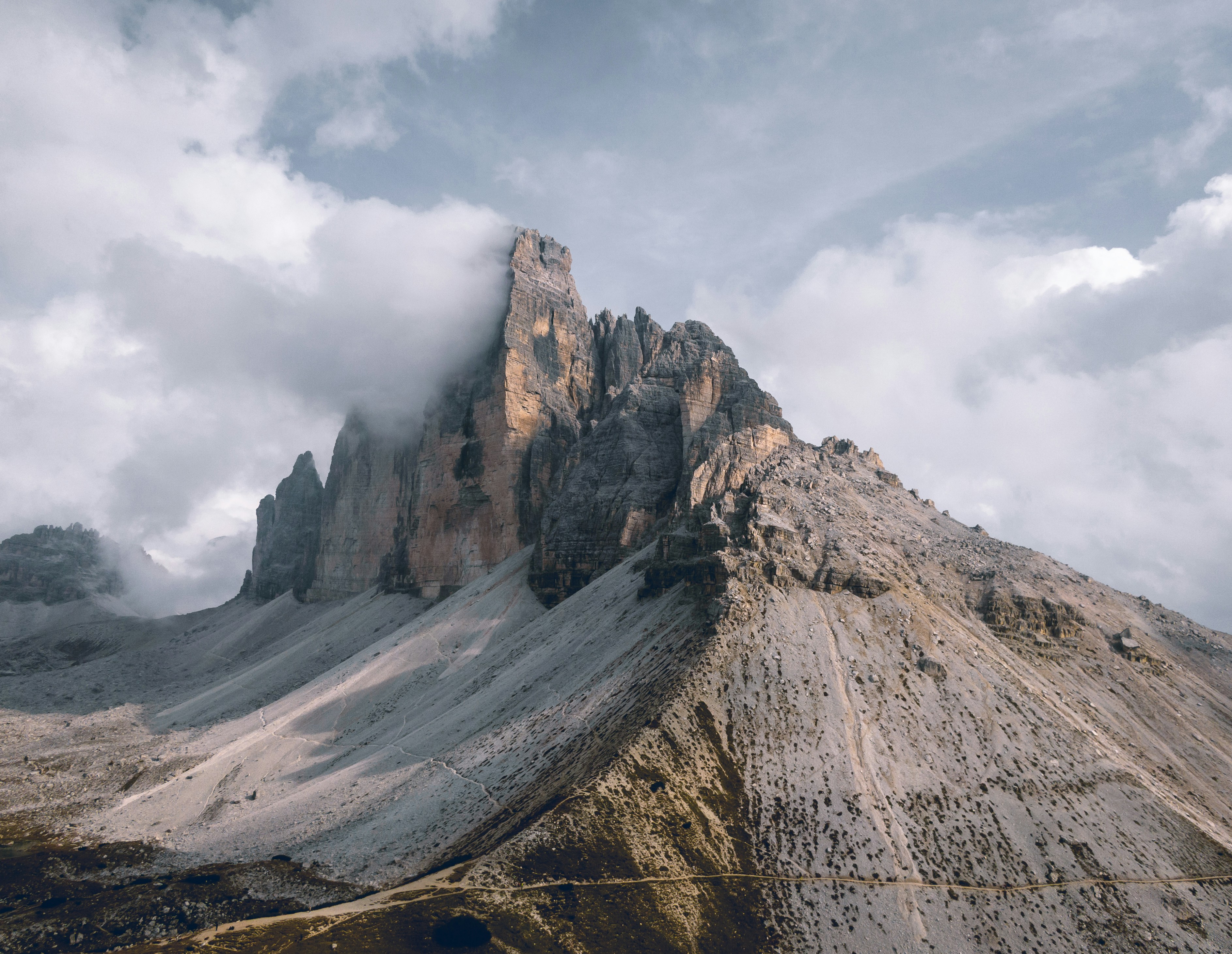 Jagged Rocky Mountain Peak Under Clouds
