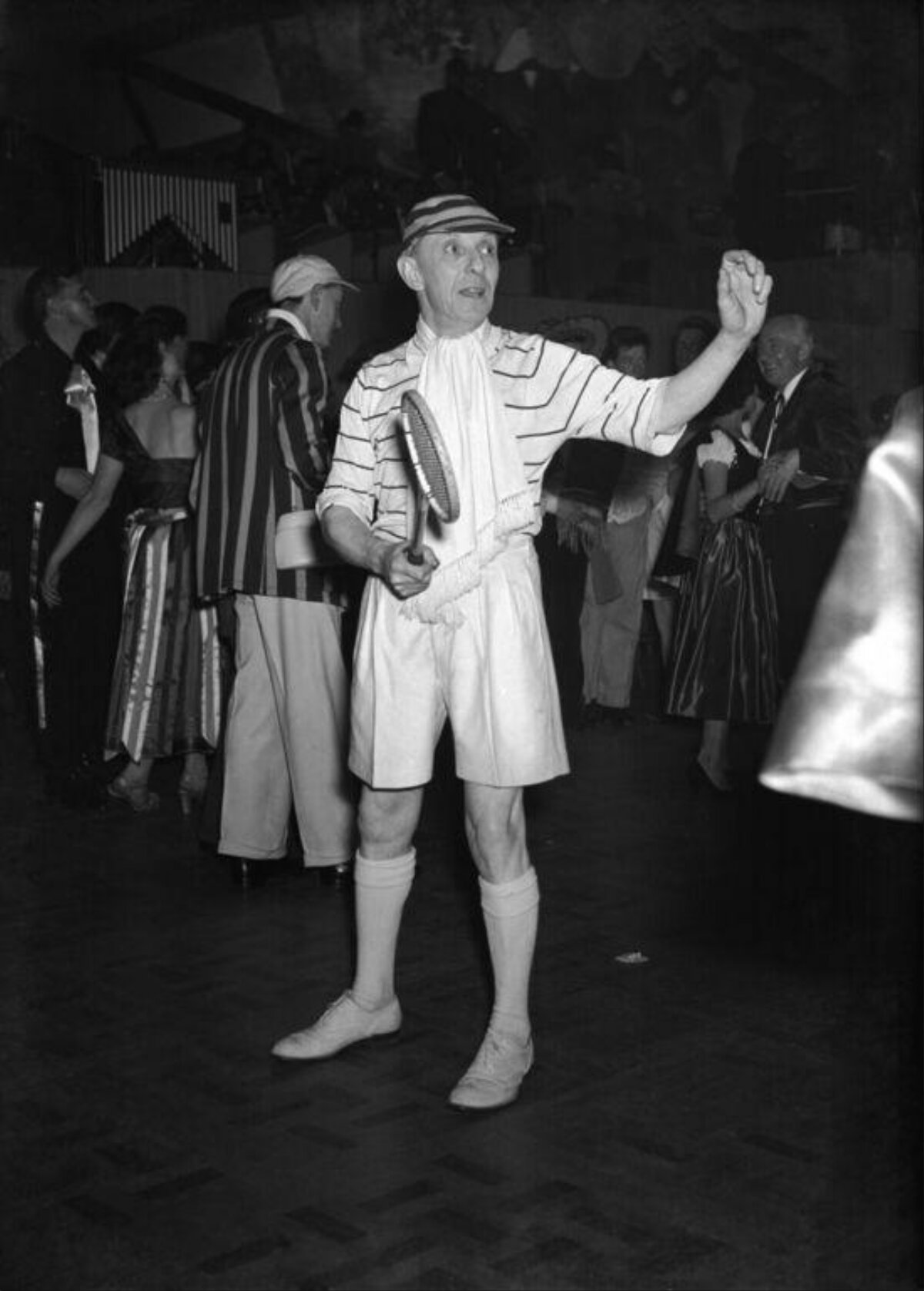 Man Dressed as Vintage Tennis Player at Party