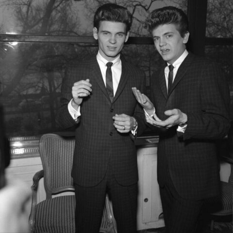 Two Dapper Suited Men Posing Together
