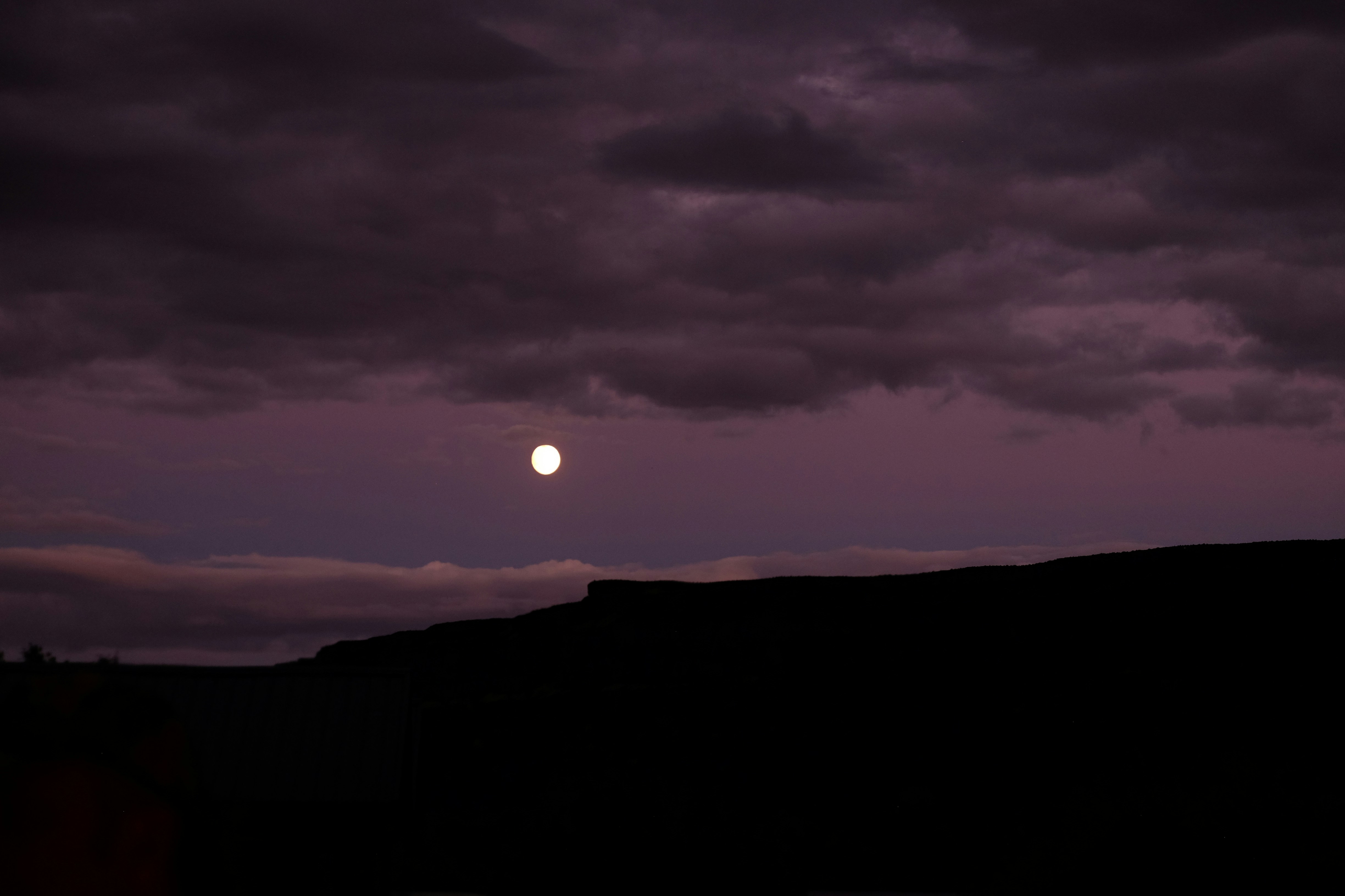 Full Moon Over Silhouetted Hill