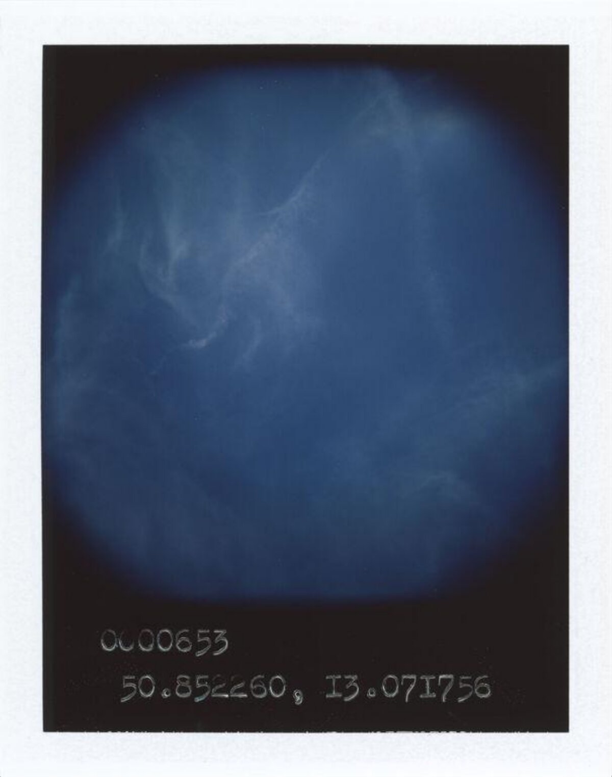 Polaroid Photo of Blue Cloudy Sky