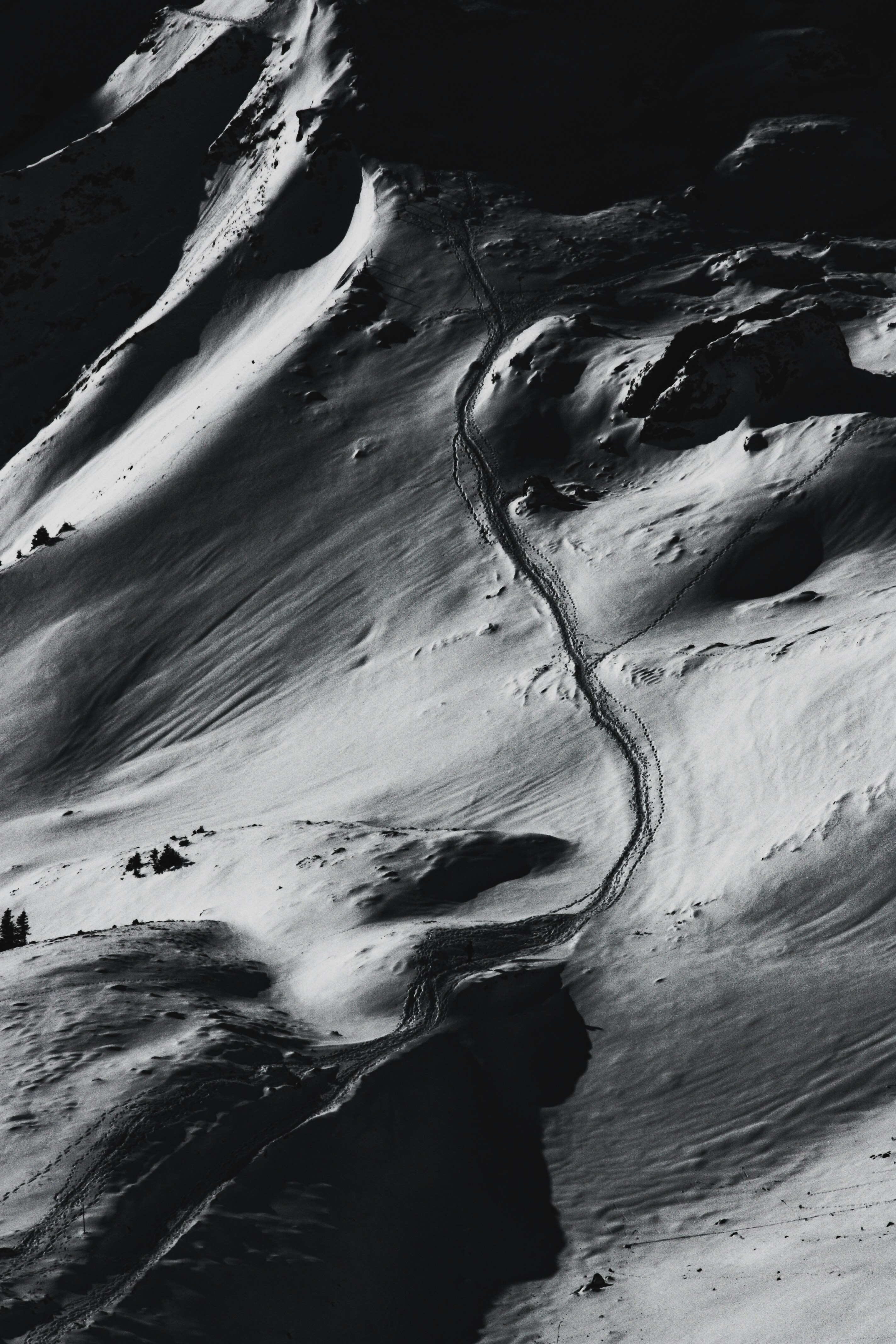 Footprints on Snowy Mountain Slope