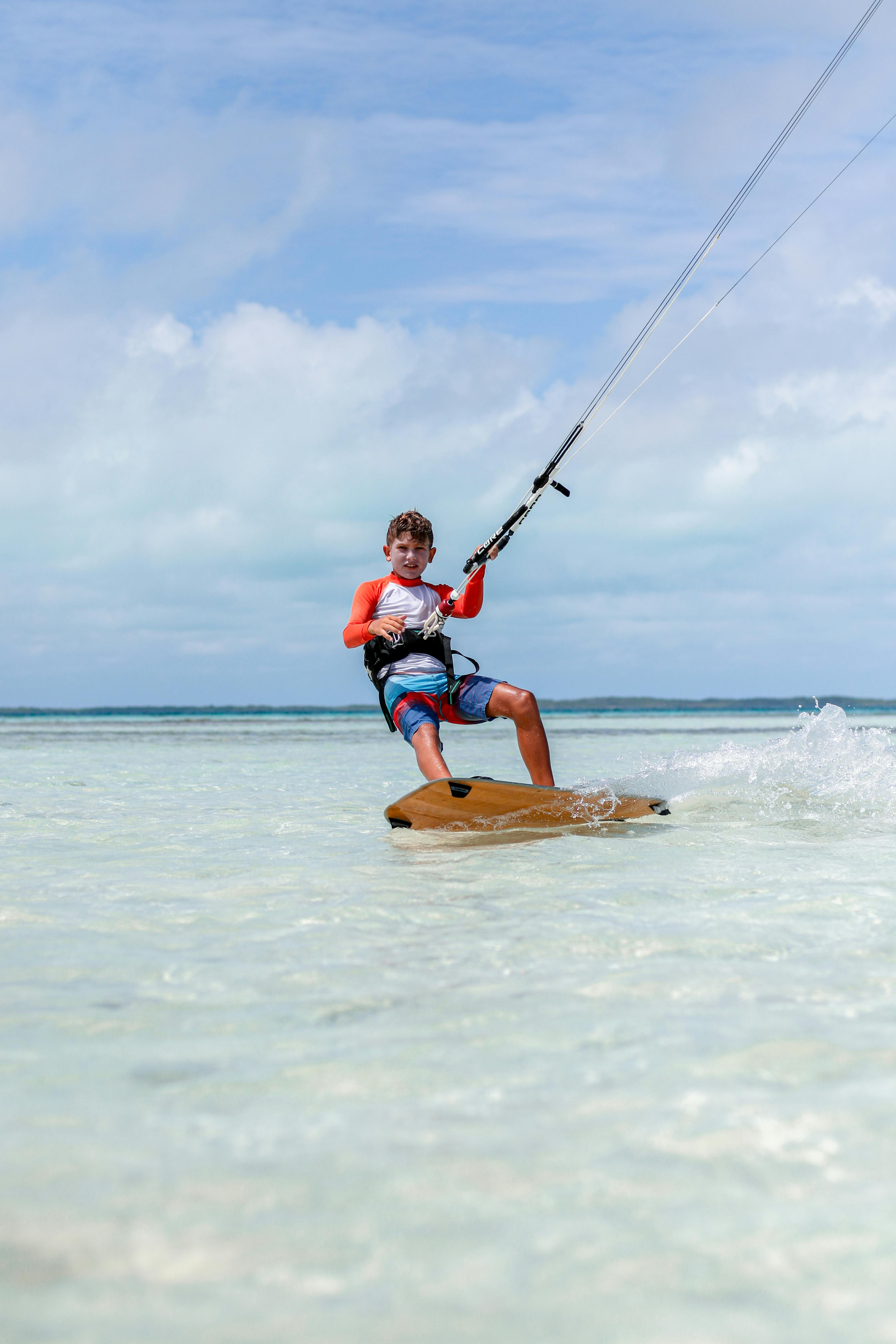 Boy Kitesurfing in Shallow Tropical Water