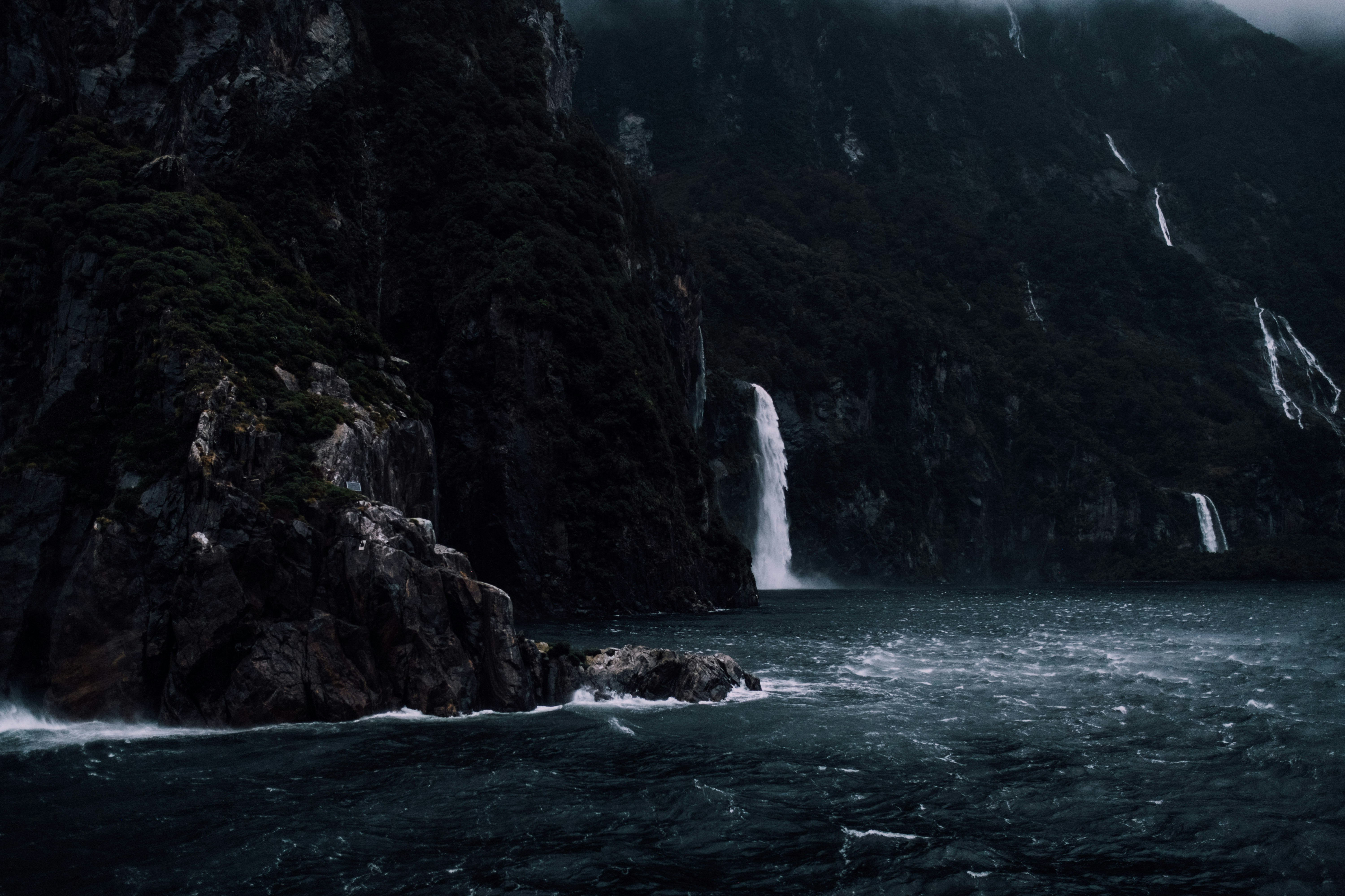 Stormy Fjord with Cliff Waterfalls