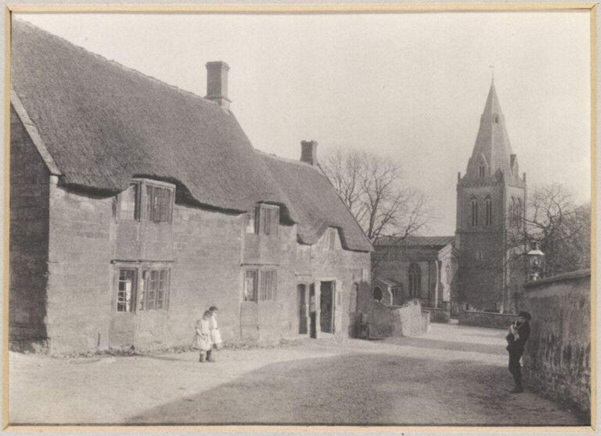 Old Village Street With Thatched Cottages and Church