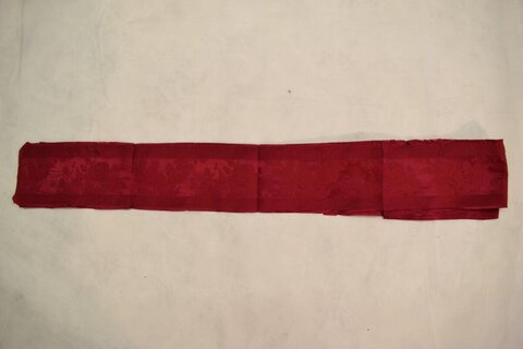 Folded Red Patterned Fabric Strip