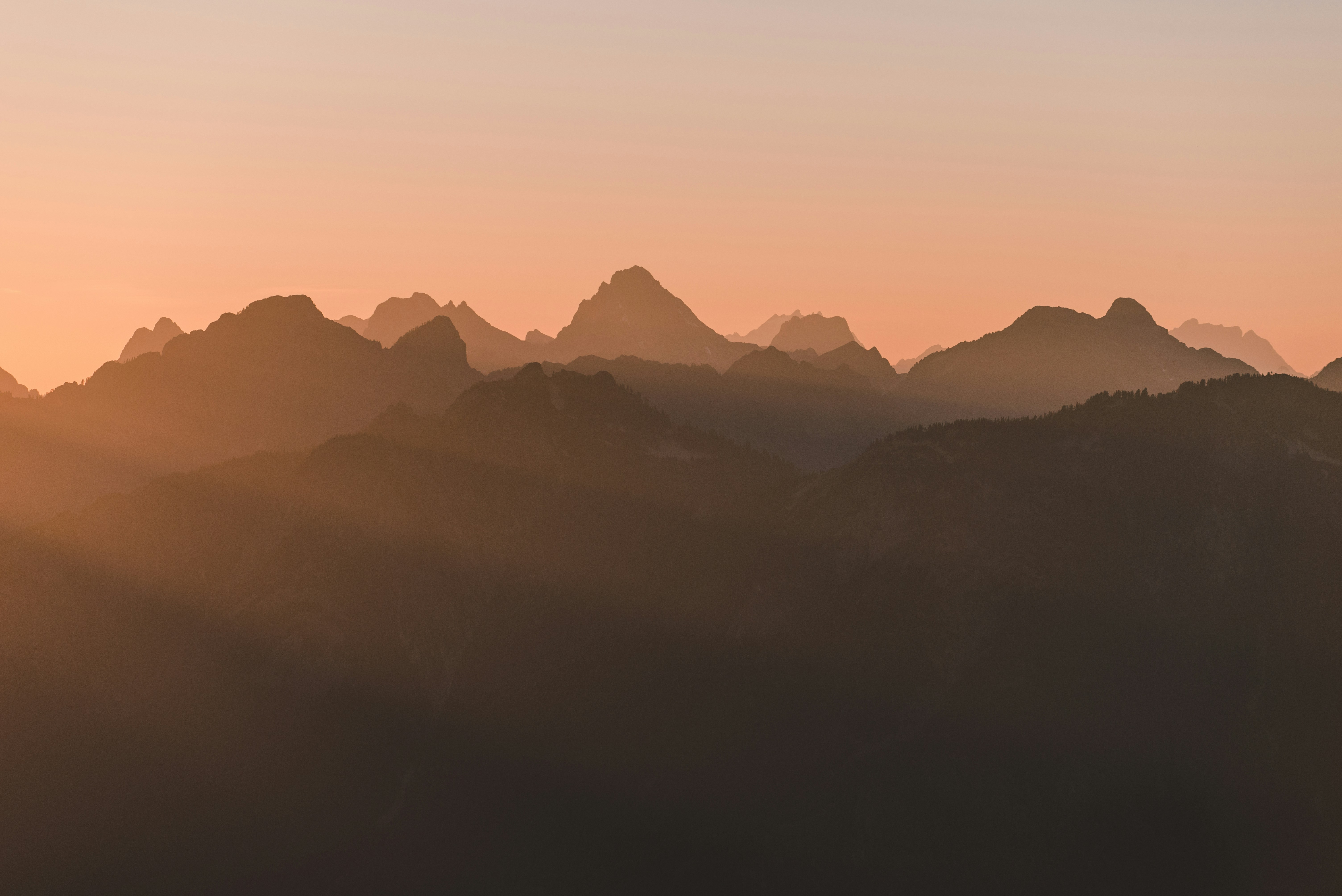 Layered Mountain Ridges at Sunset