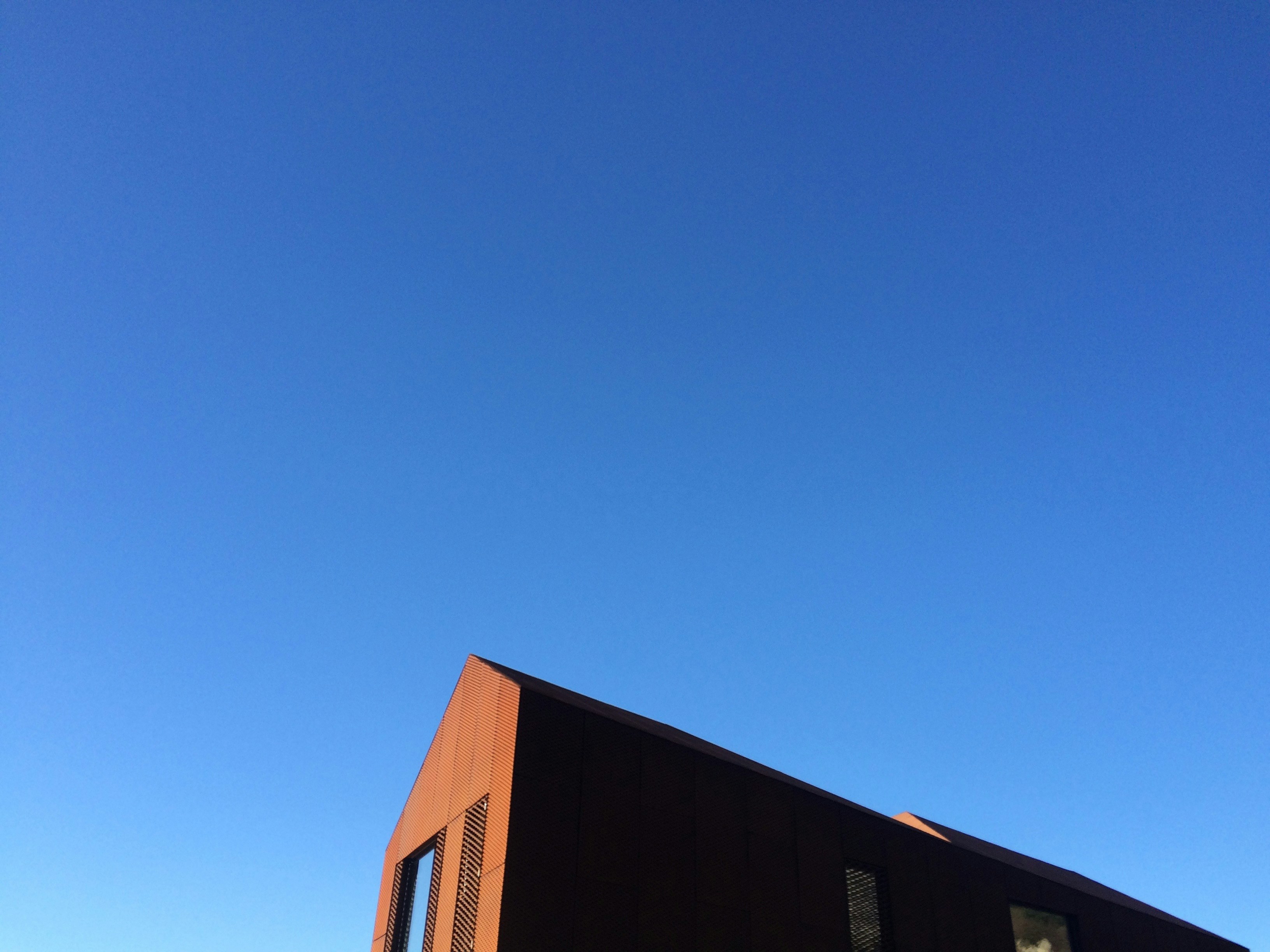Building Roof Under Clear Blue Sky