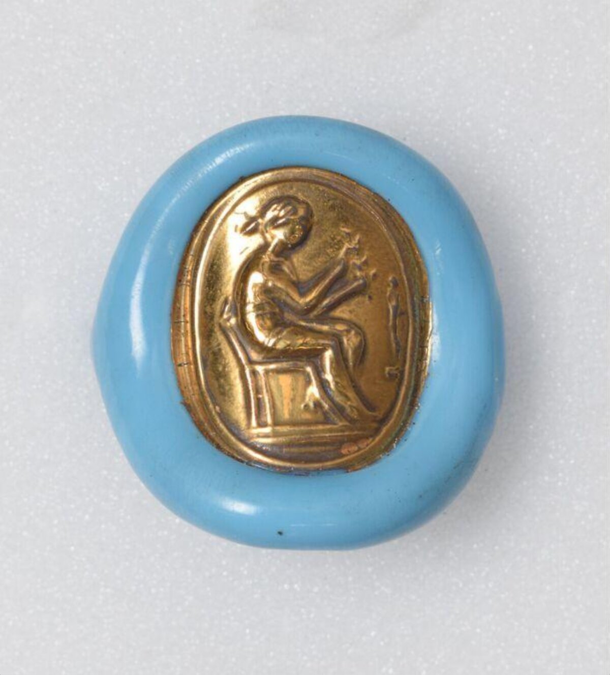 Blue Framed Gold Embossed Figure Brooch