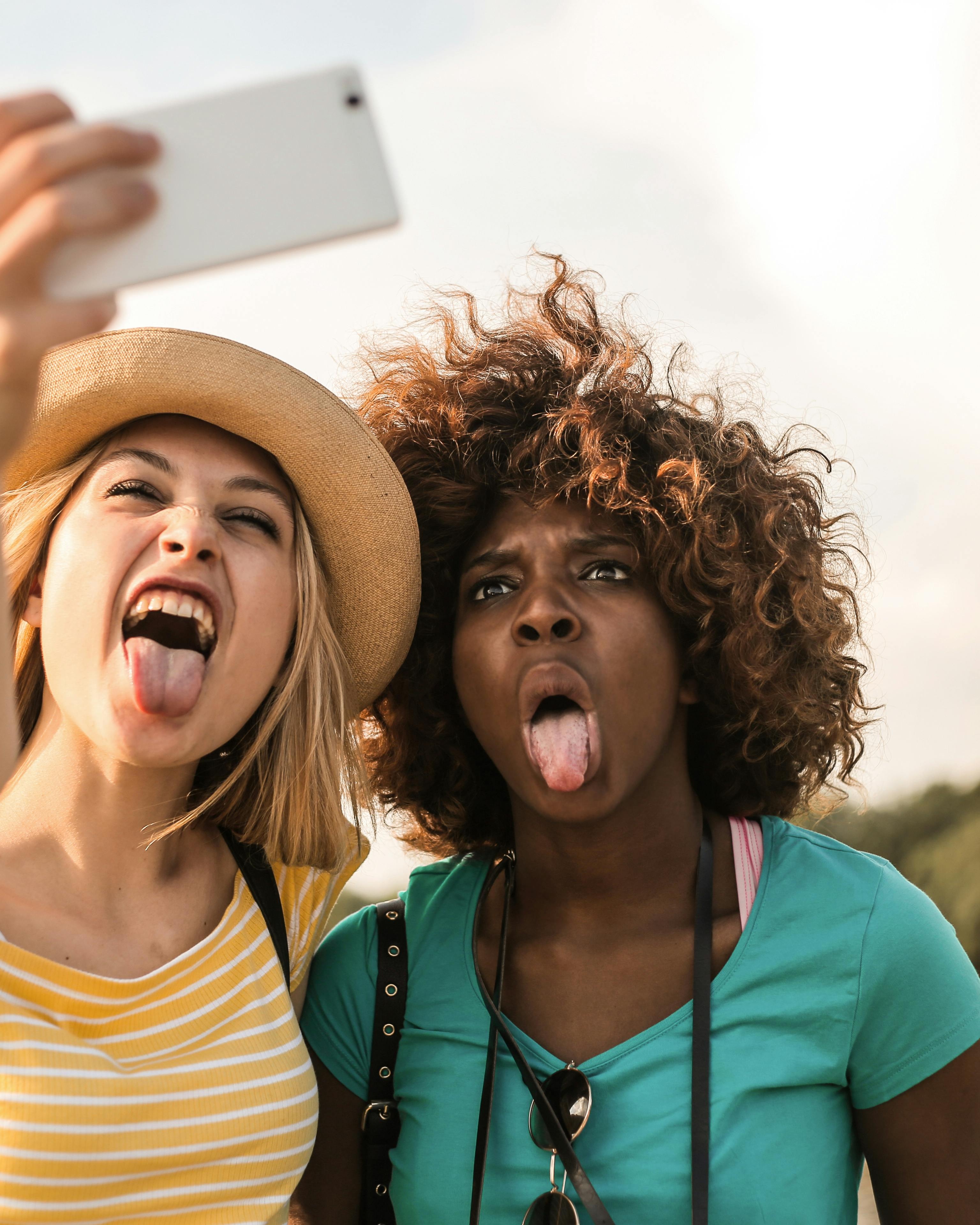 Two Friends Taking a Silly Selfie