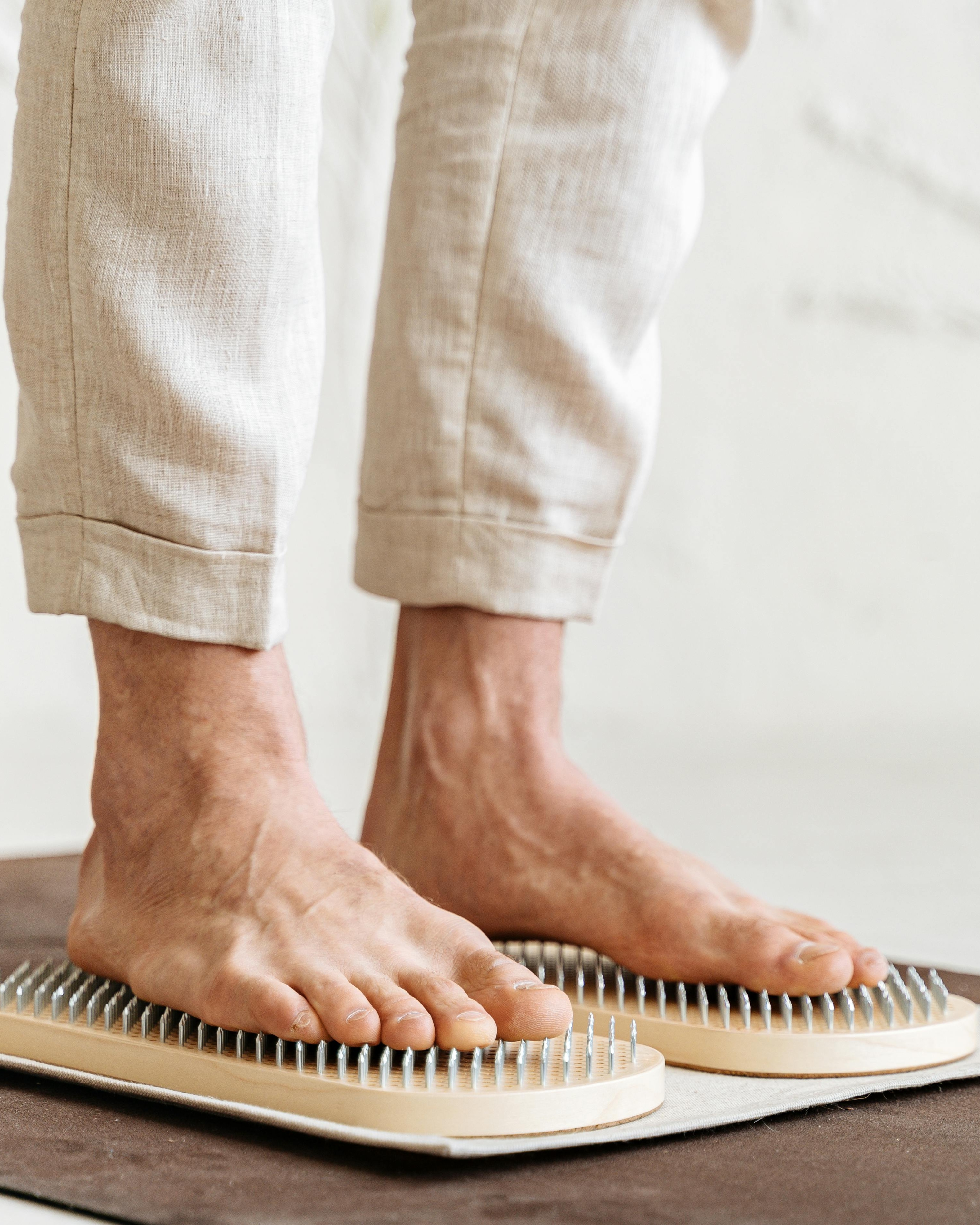 Person Standing on Sadhu Nail Boards