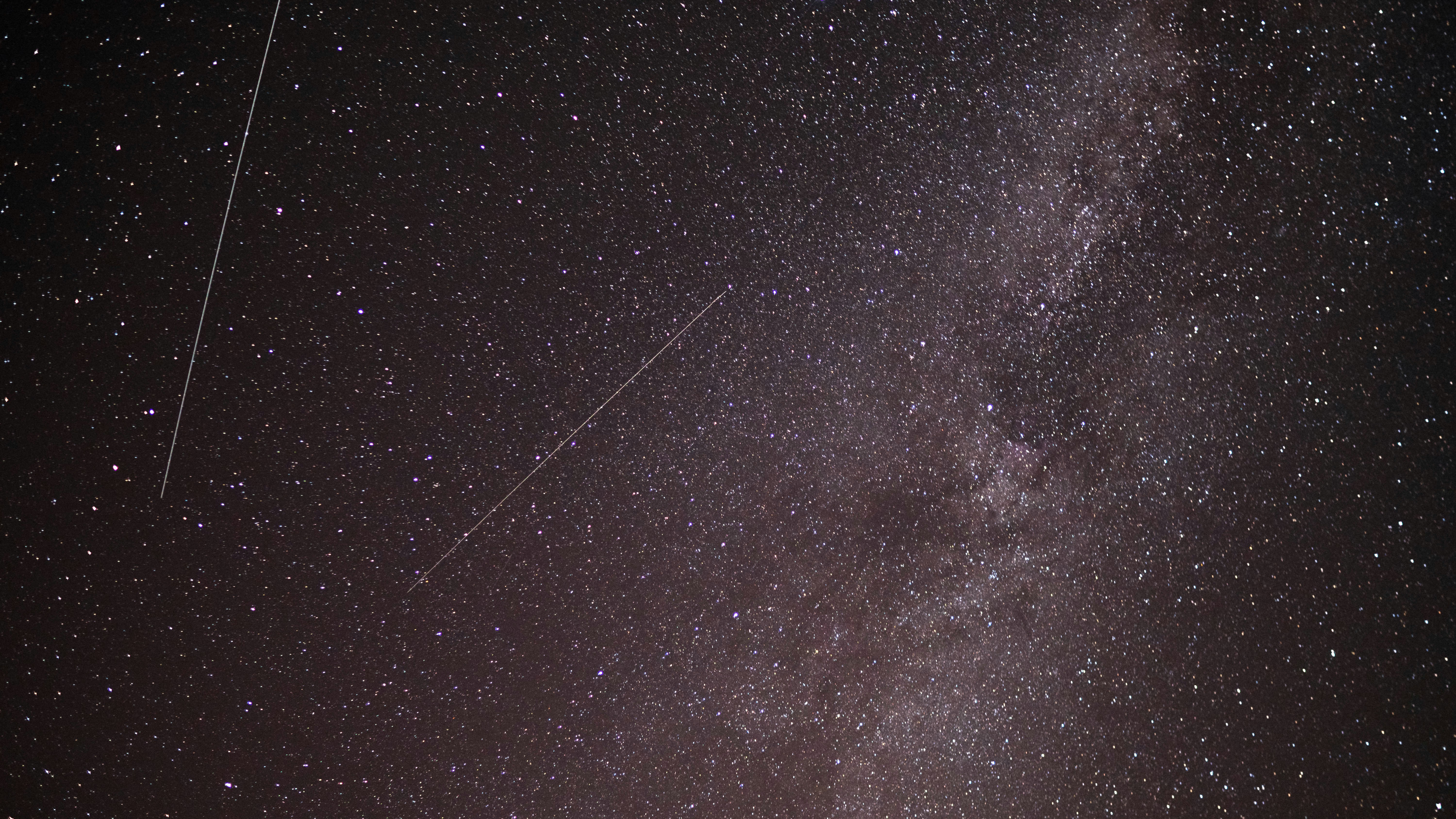 Starry Night Sky with Satellite Trails