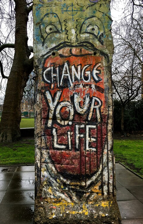 Change Your Life Graffiti on Old Wall