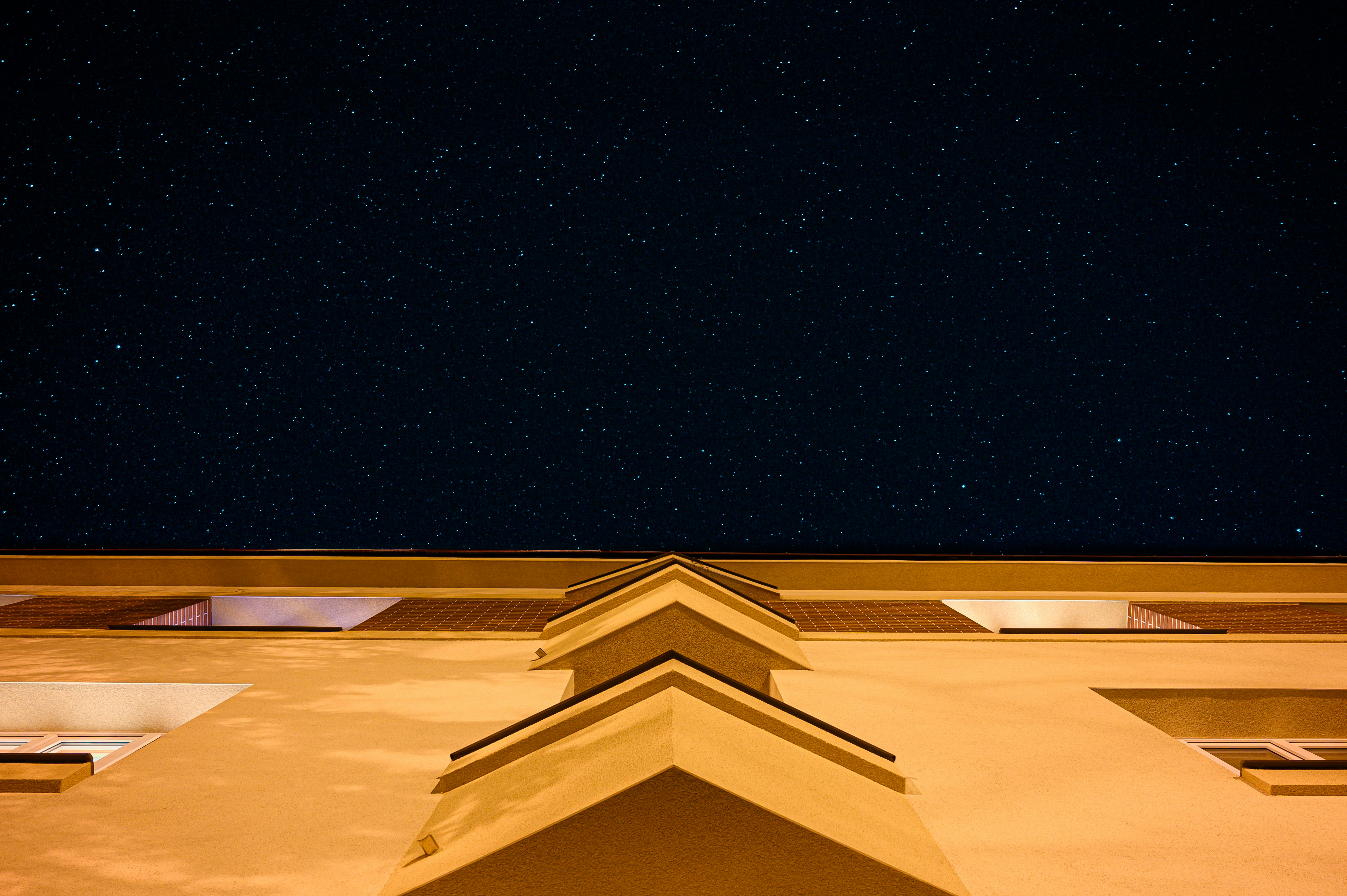 Starry Night Above Building Roof