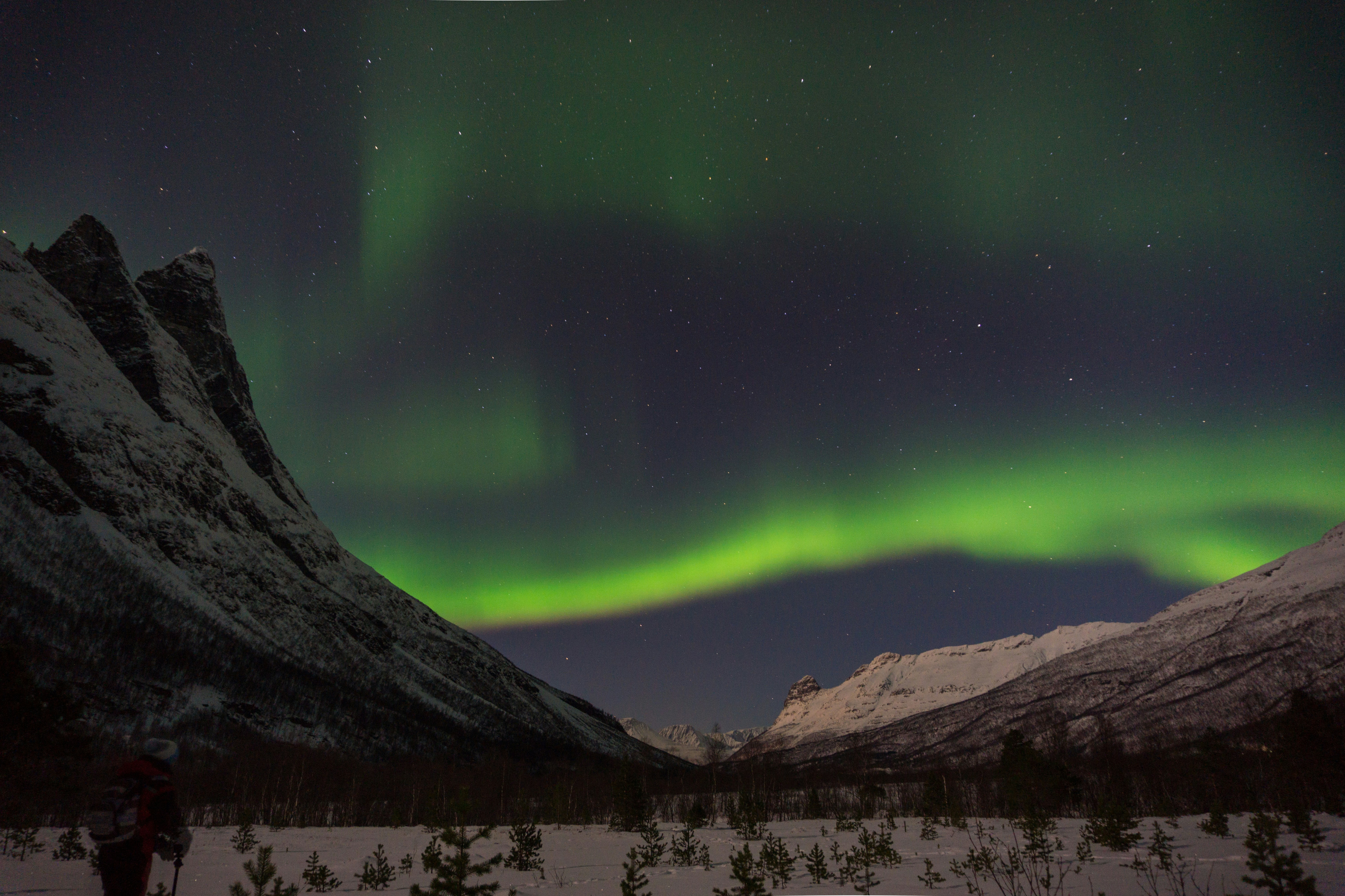 Aurora Borealis Over Snowy Mountains
