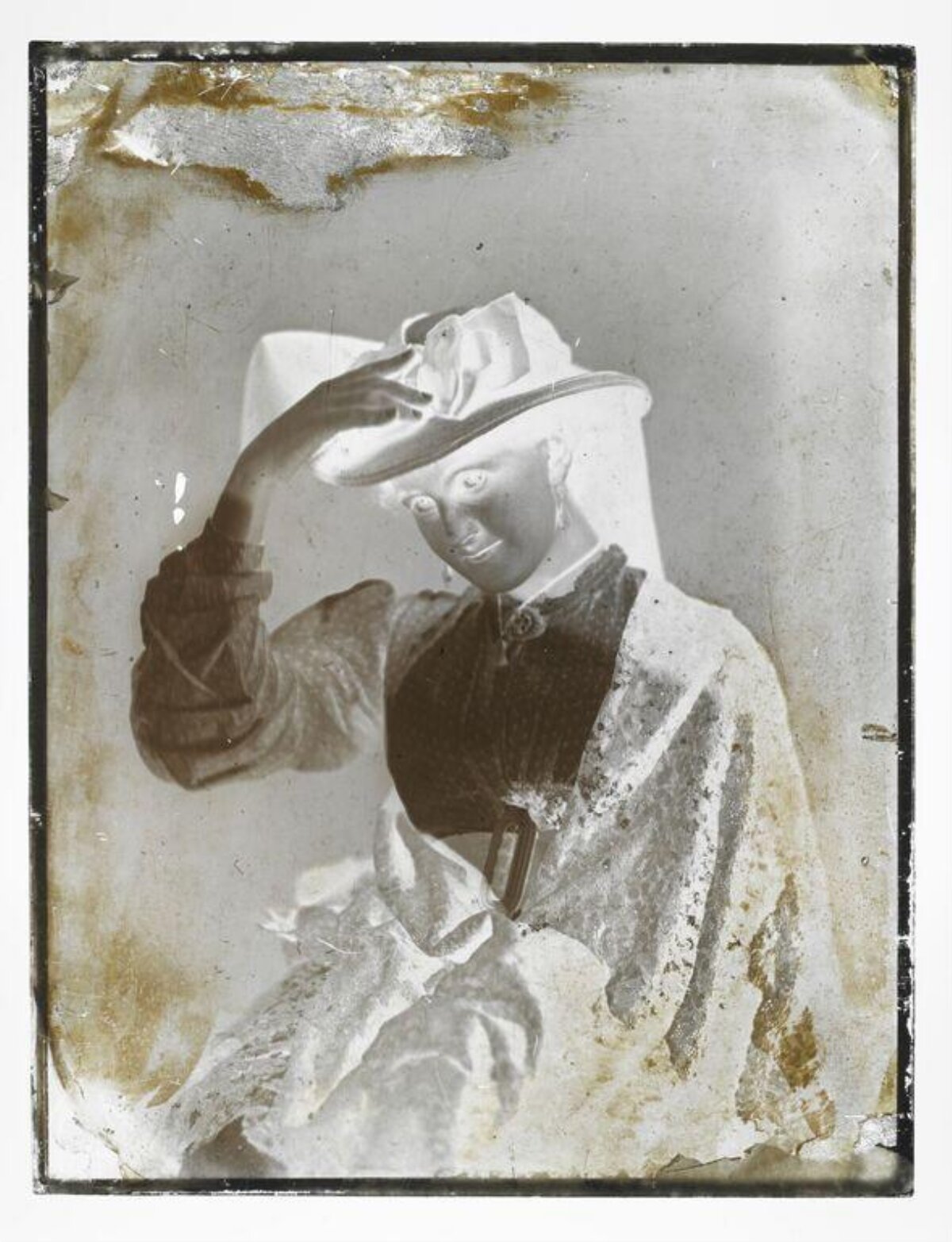 Damaged Vintage Negative of Woman Adjusting Hat