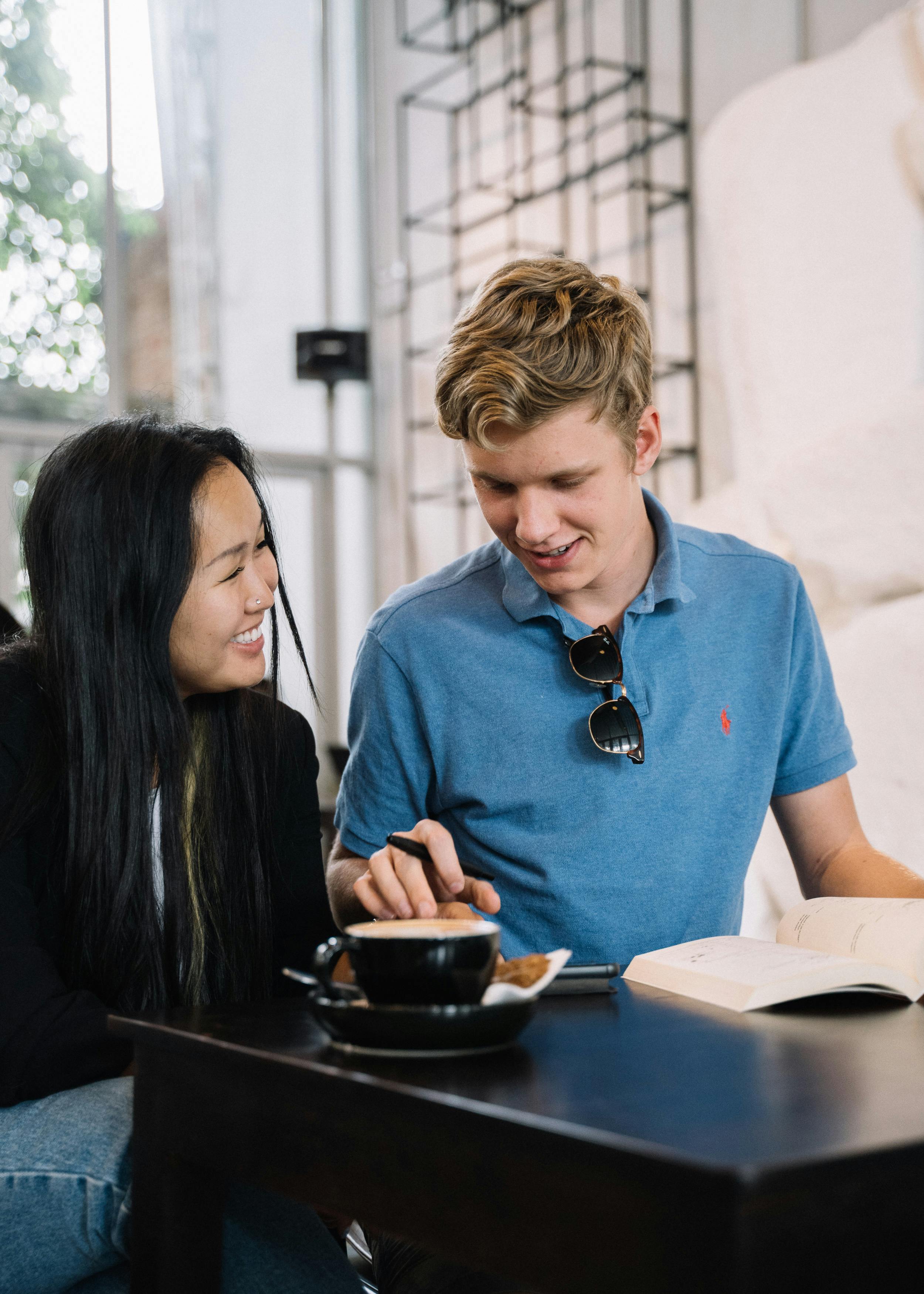 Two People Studying at a Cafe