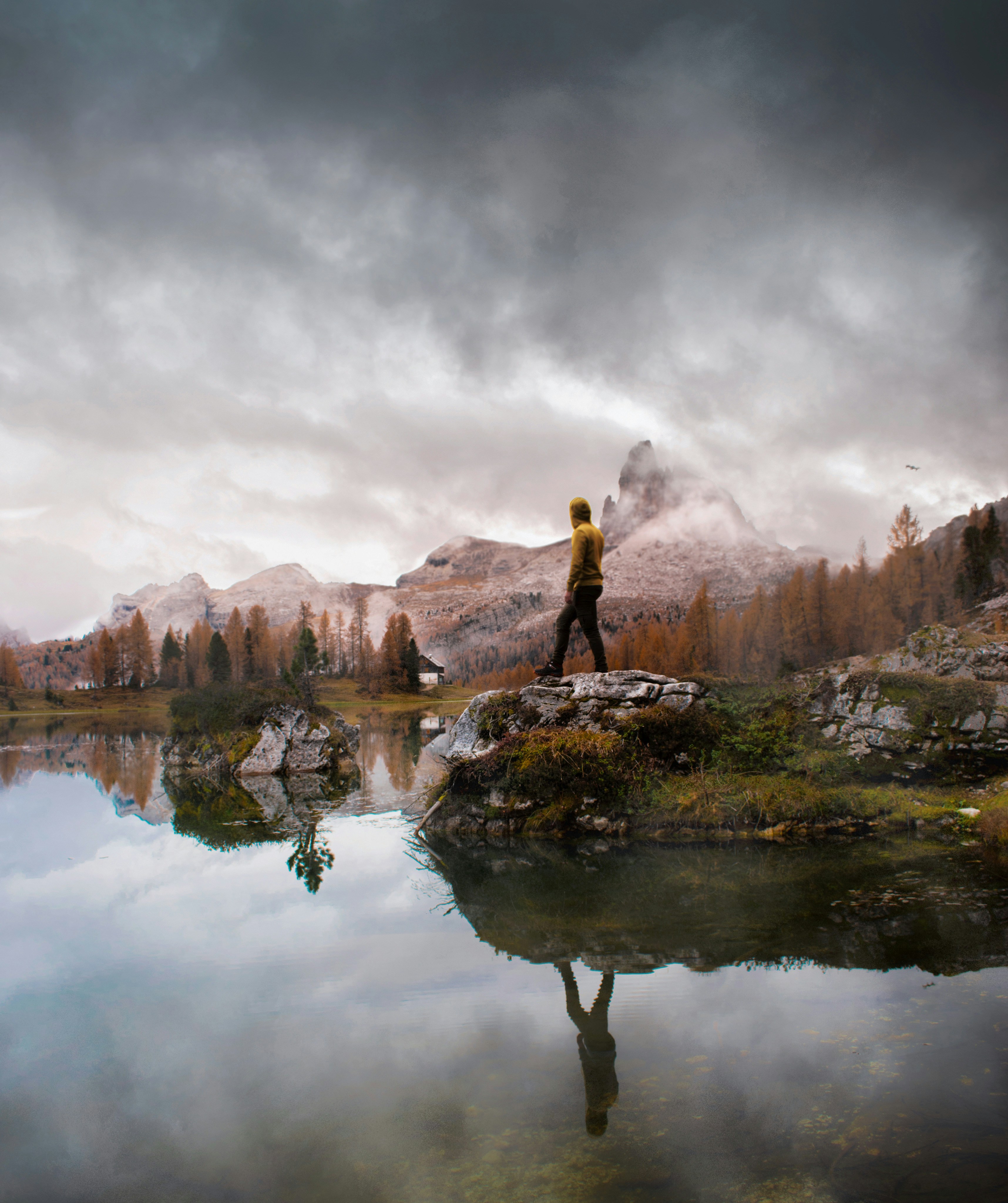 Hiker Overlooking Autumn Mountain Lake
