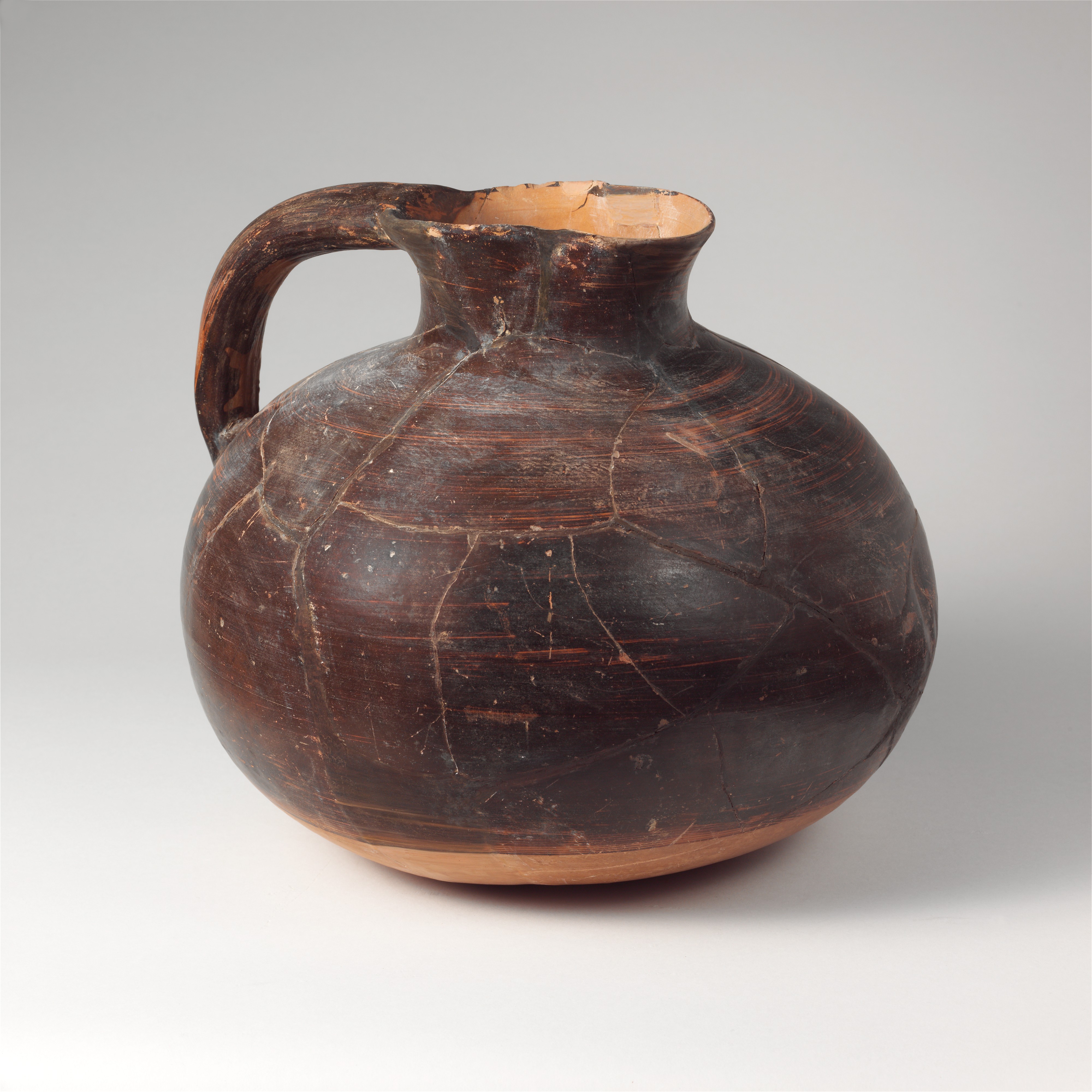 Restored Ancient Black Pottery Jug