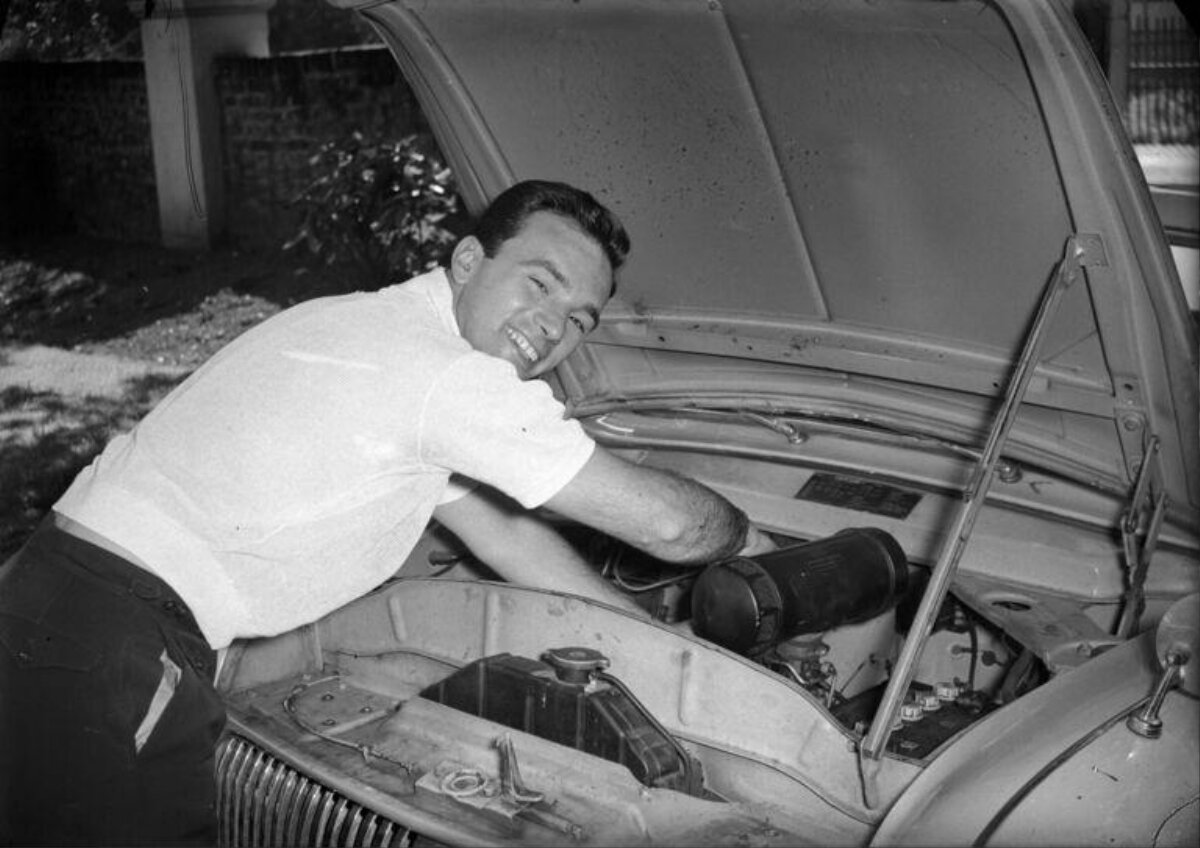 Man Fixing Vintage Car Engine