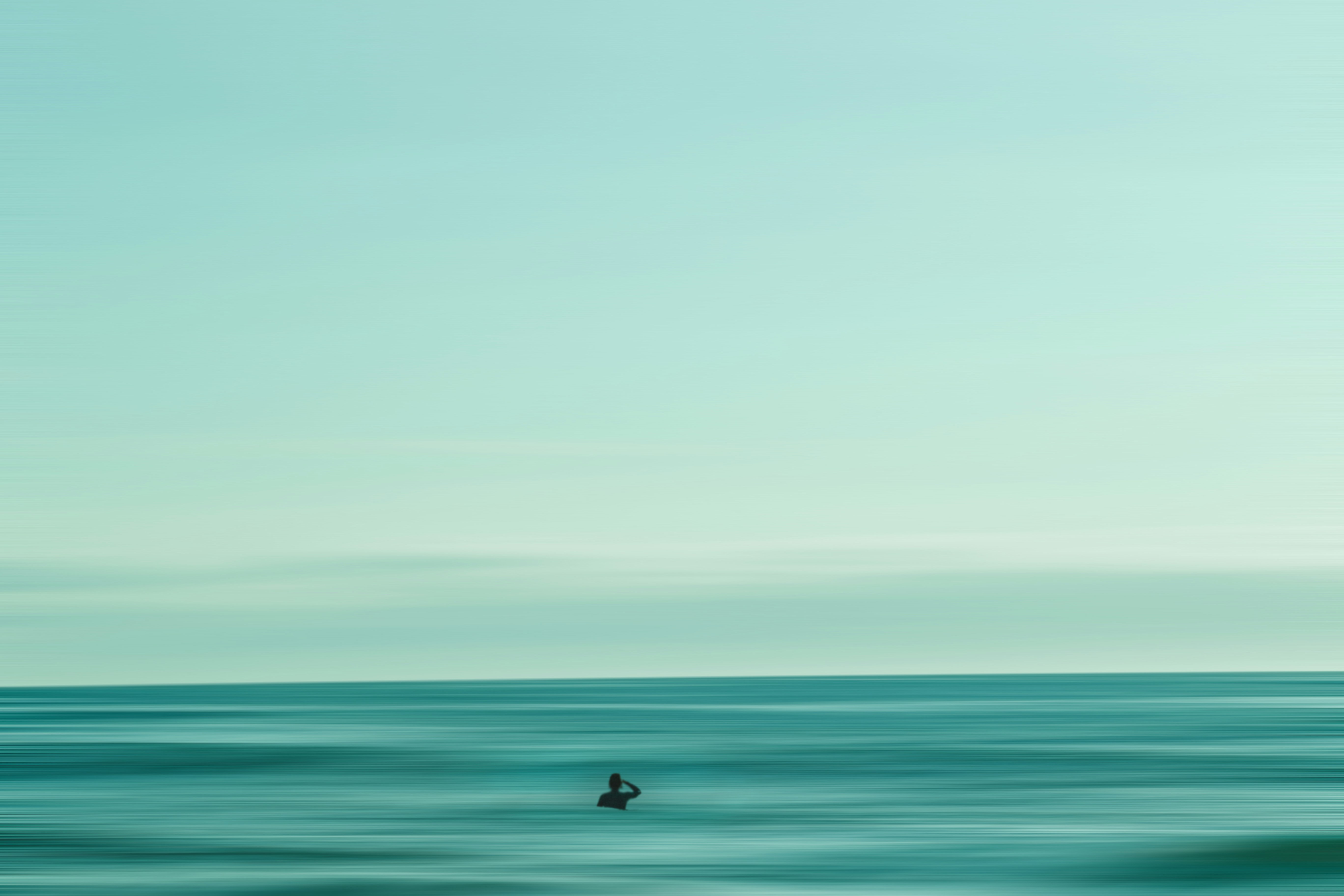 Silhouette of Person in Calm Sea