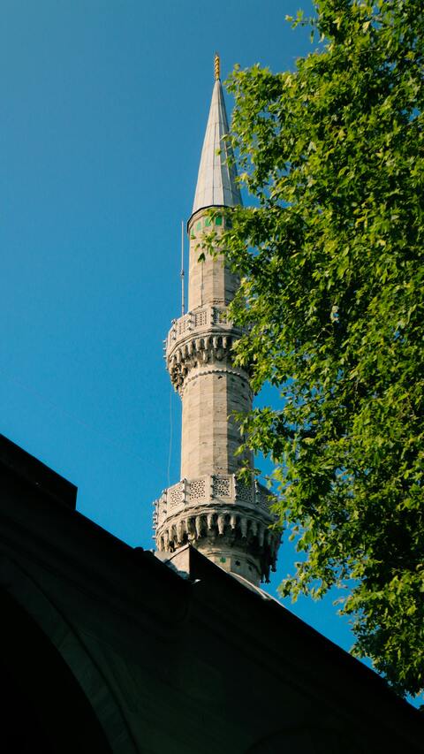 Stone Mosque Minaret Under Blue Sky