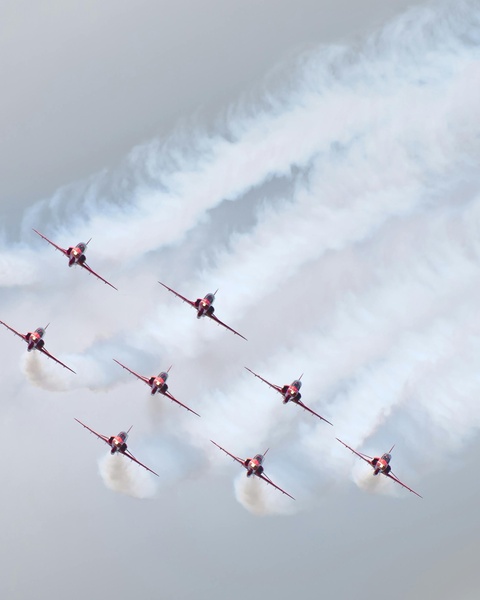 Red Aerobatic Jets in Formation Flight