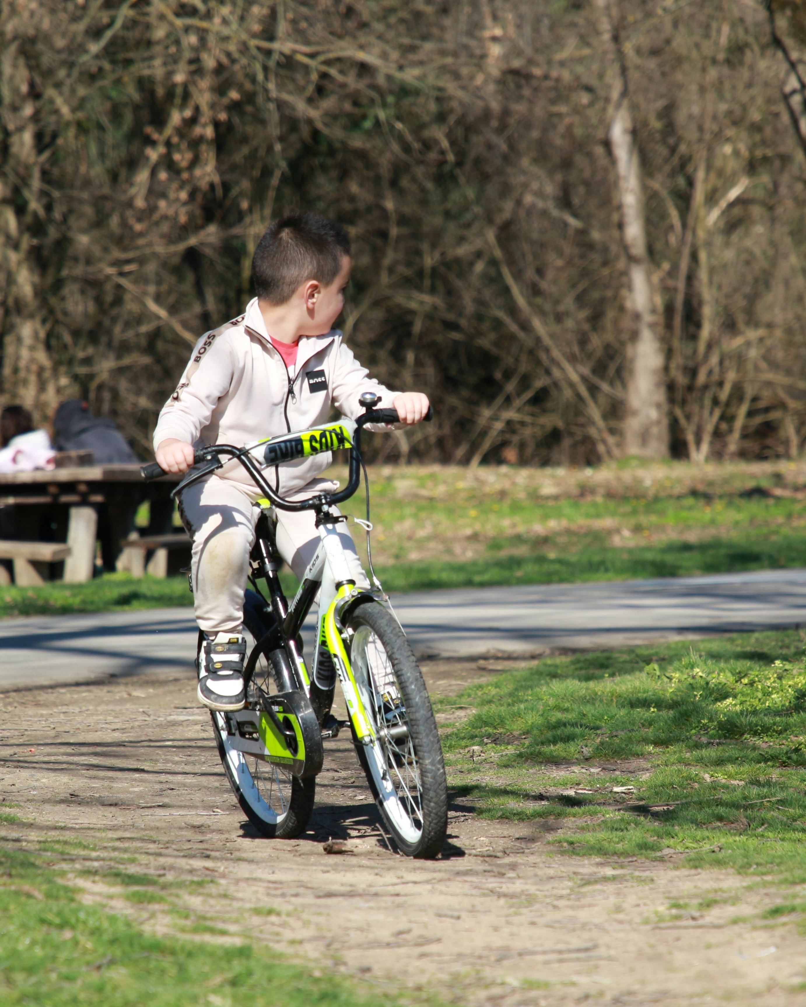 Boy Riding Bicycle in Park