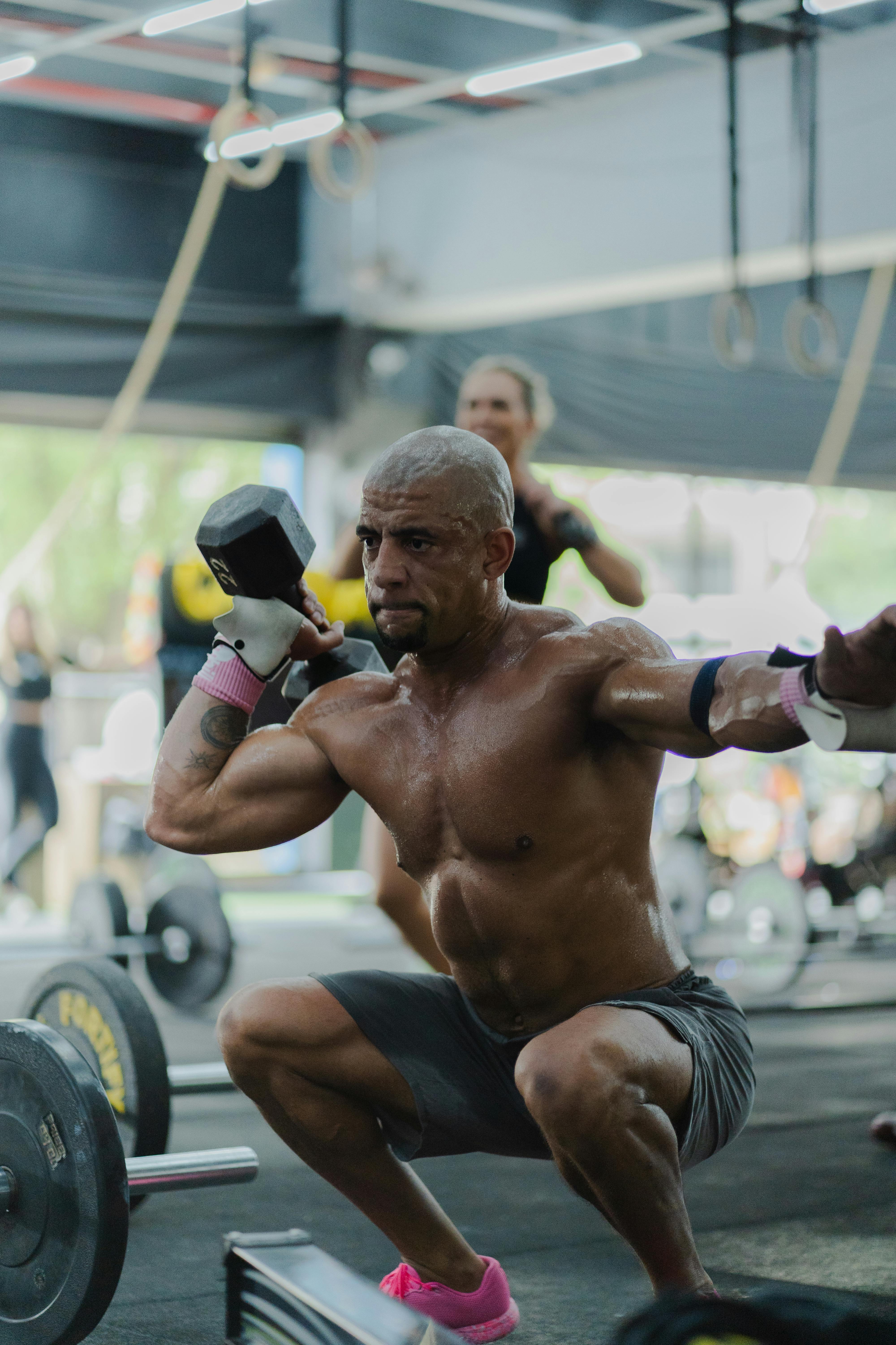 Shirtless Man Doing Dumbbell Workout