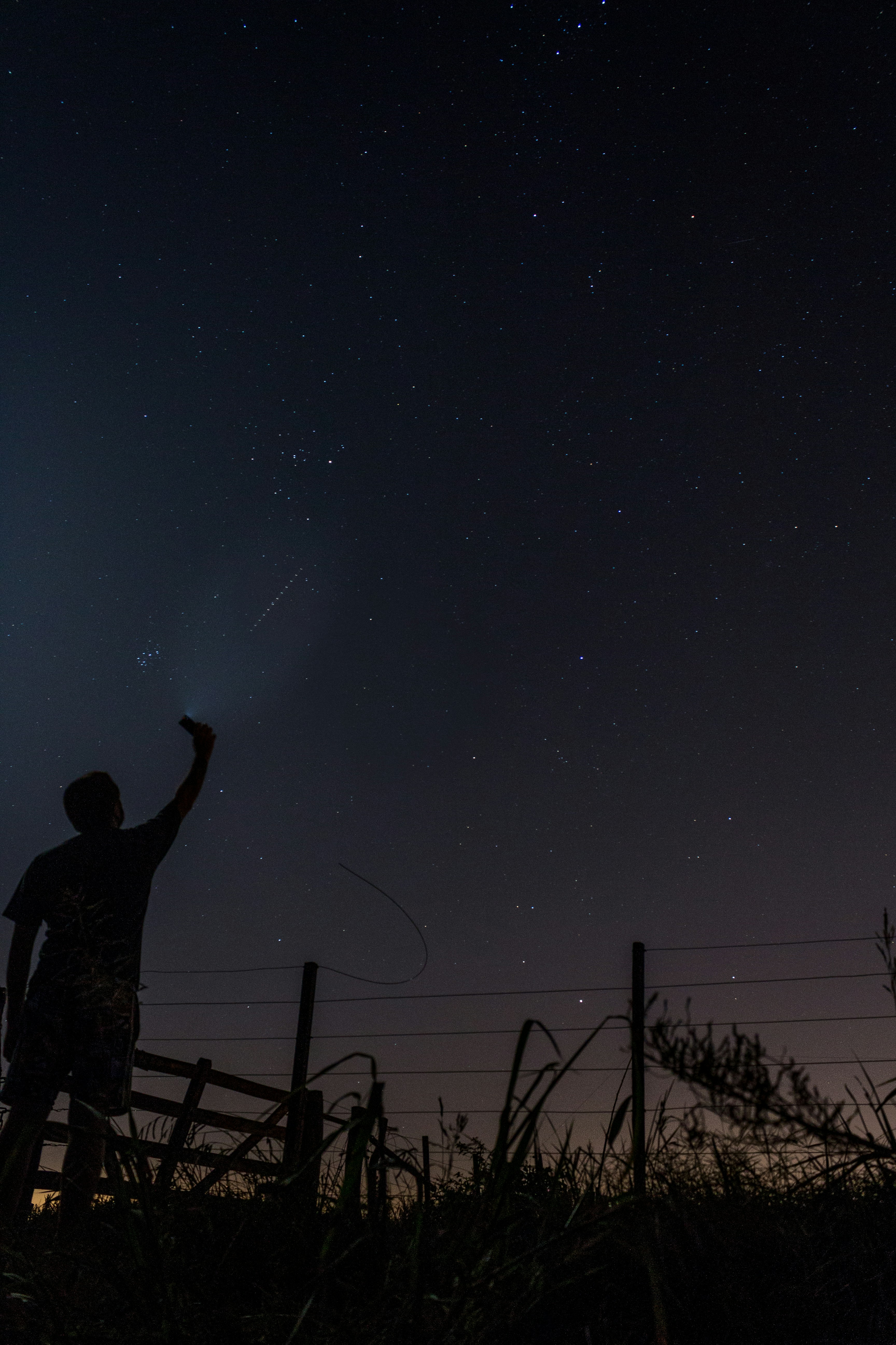 Person Reaching For Stars Under Night Sky