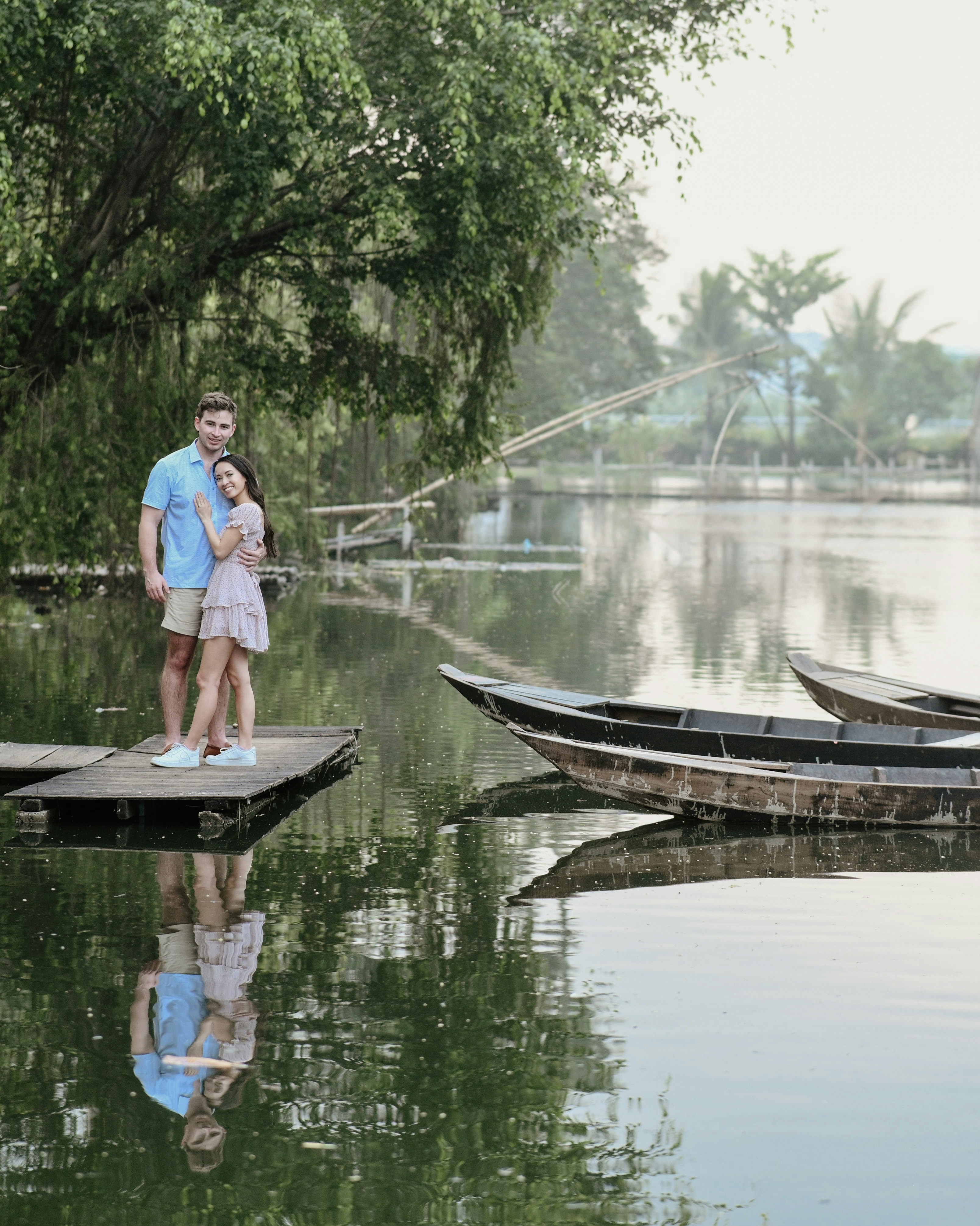 Couple Posing on Calm Lake Dock