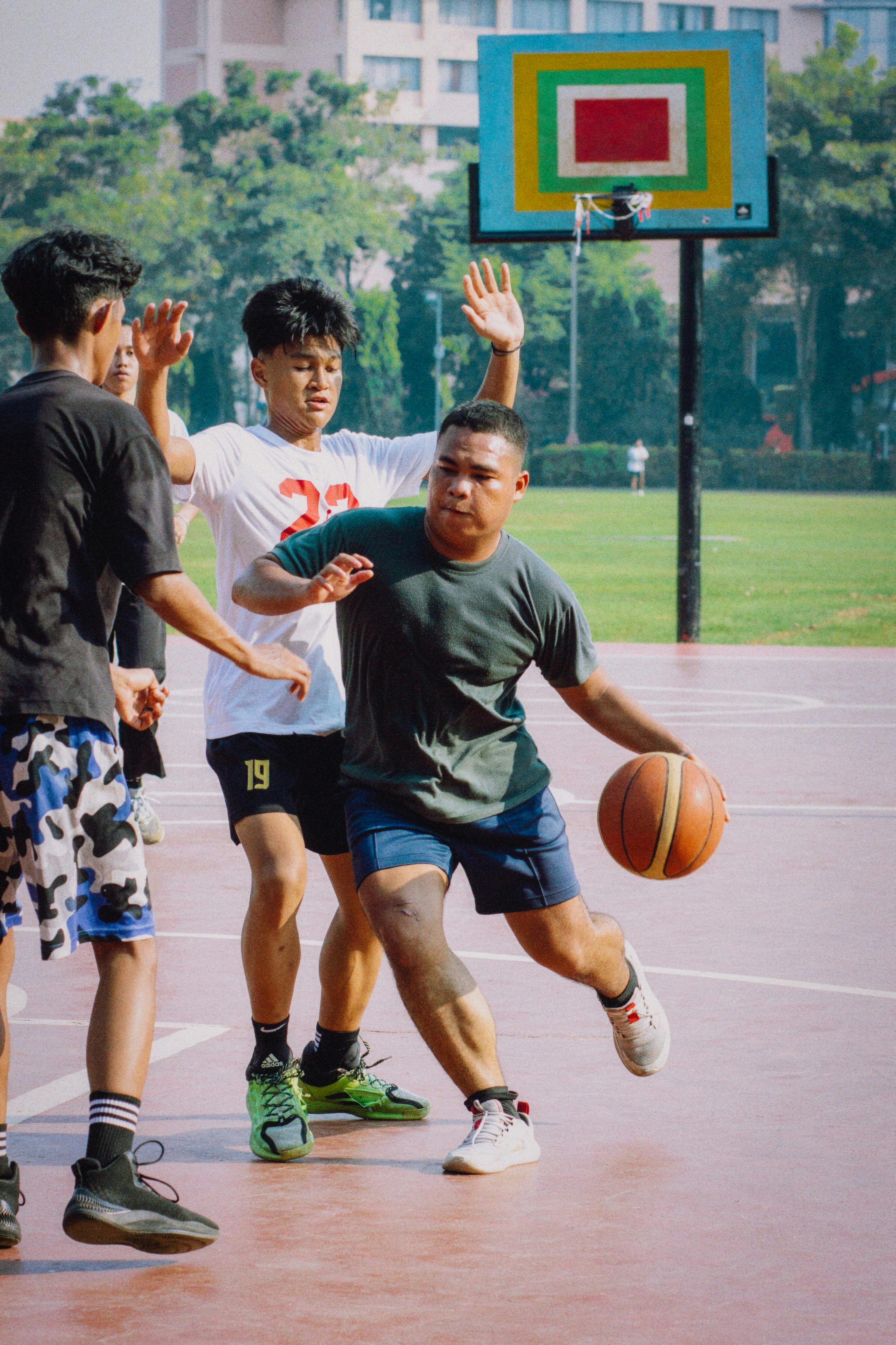 Young Men Playing Outdoor Basketball