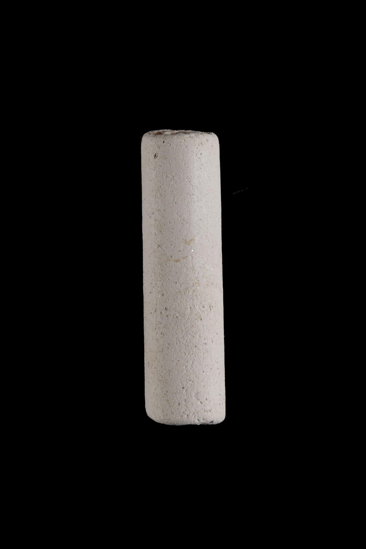 Pale Cylindrical Stone Object — Black Backgrounds