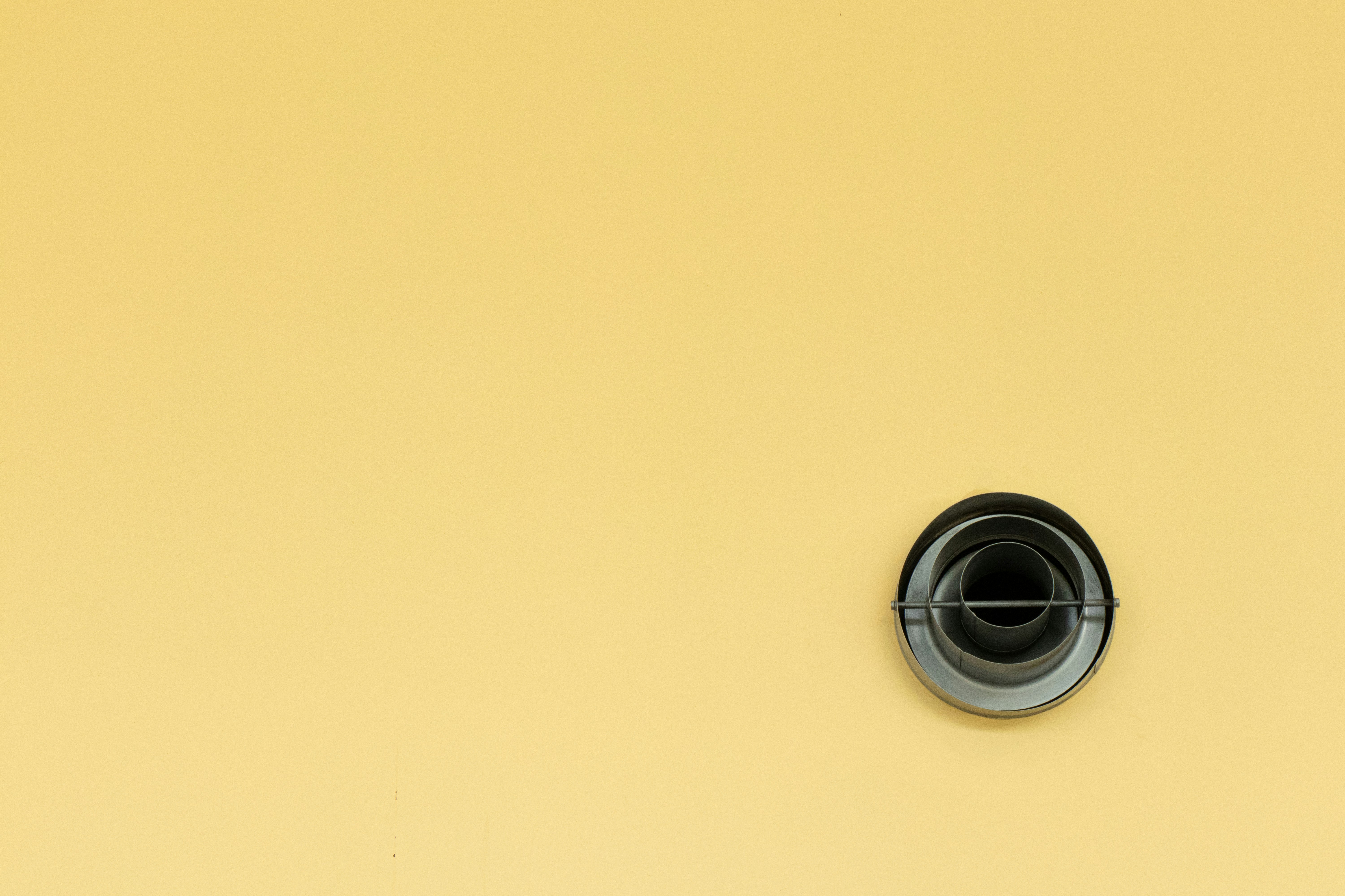 Ventilation Outlet on Yellow Wall — Minimal Wallpapers