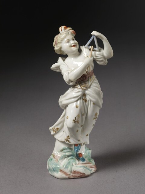 Porcelain Woman Playing Triangle Figurine