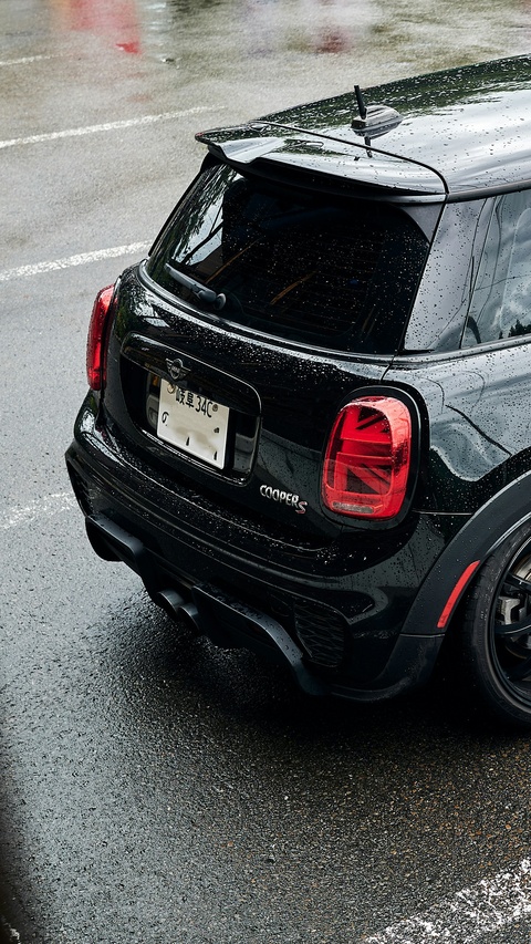 Black Mini Cooper S on Rainy Pavement
