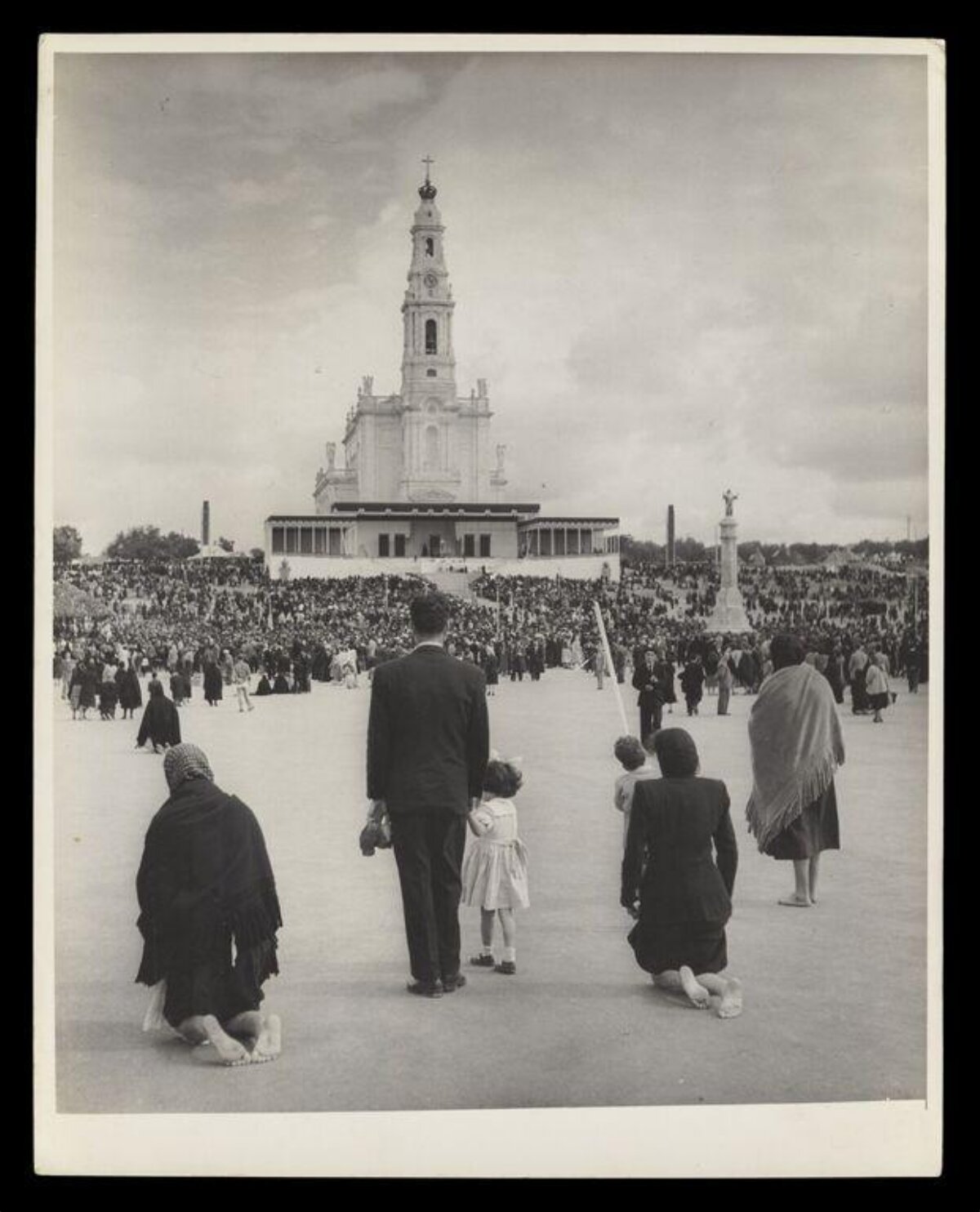 Kneeling Pilgrims at Religious Sanctuary