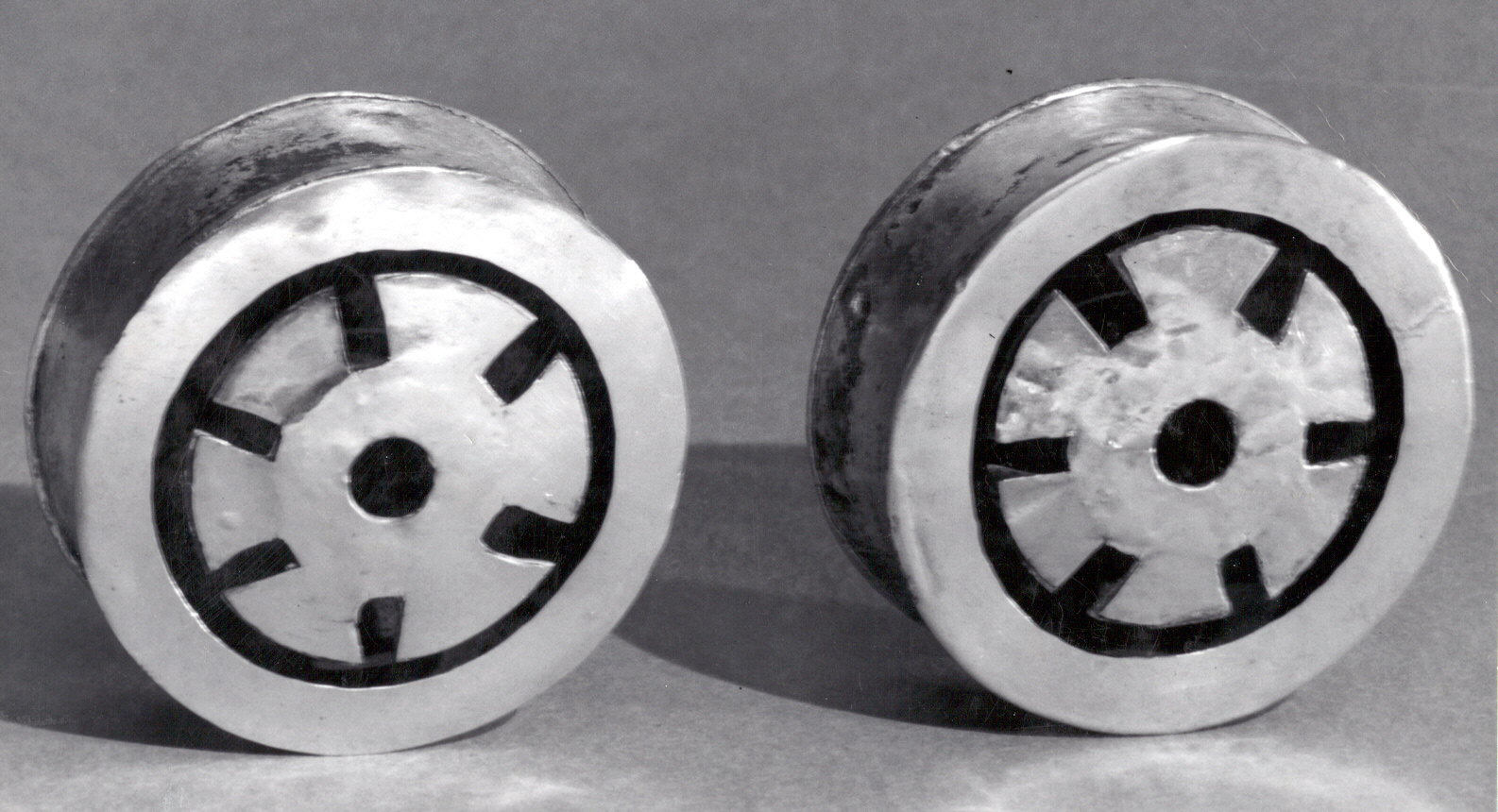 Two Metallic Mechanical Cylinder Parts