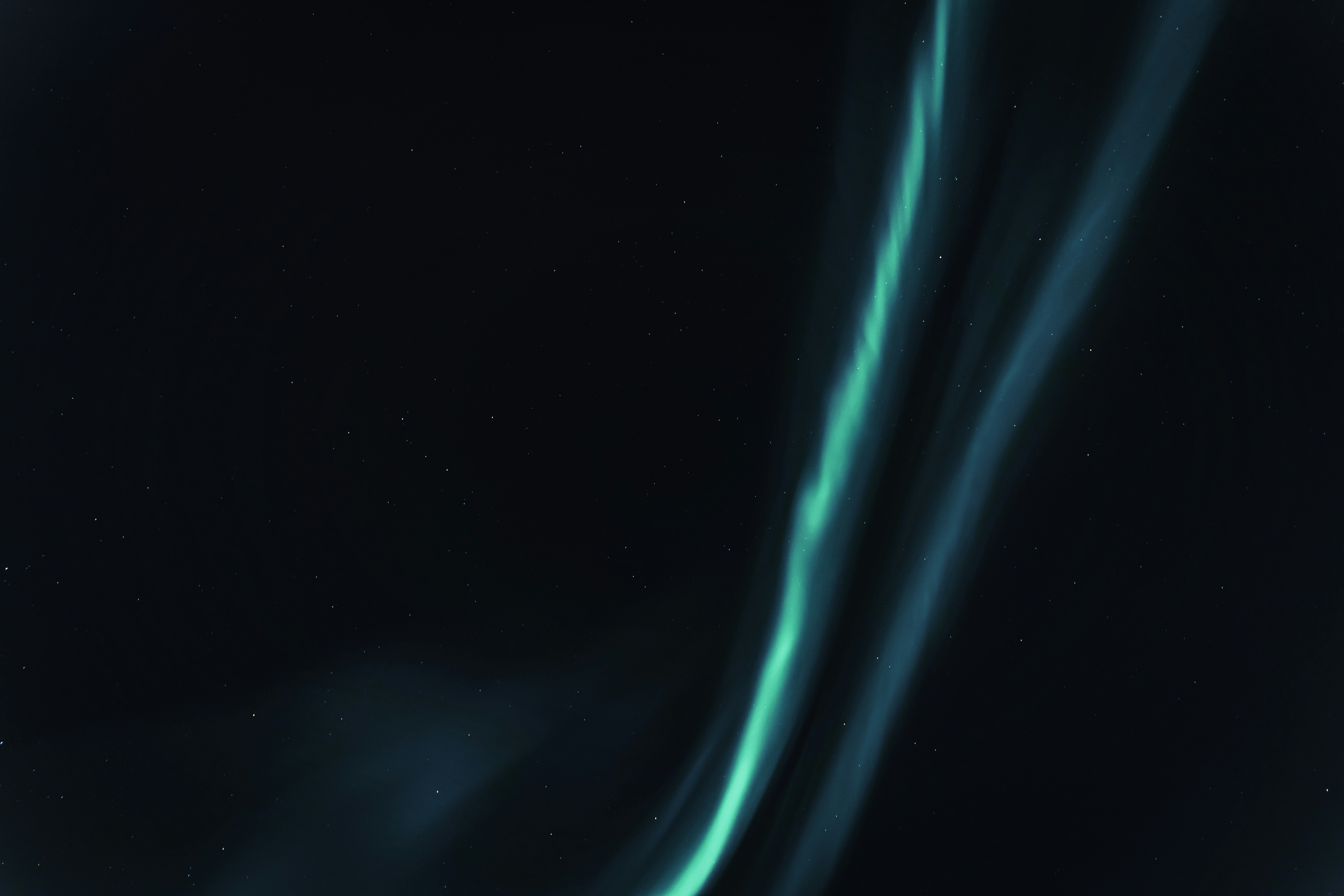 Green Aurora in Starry Night Sky