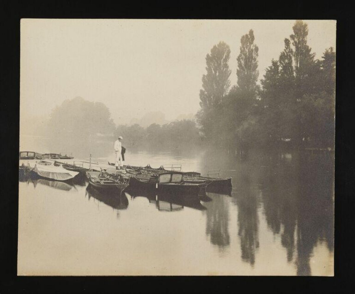 Misty River with Moored Rowboats
